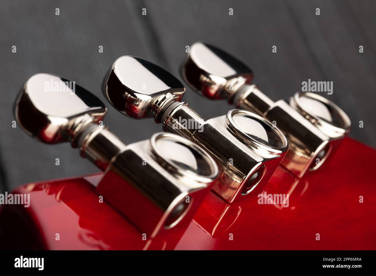 electric guitar tuning machines on wood background Stock Photo