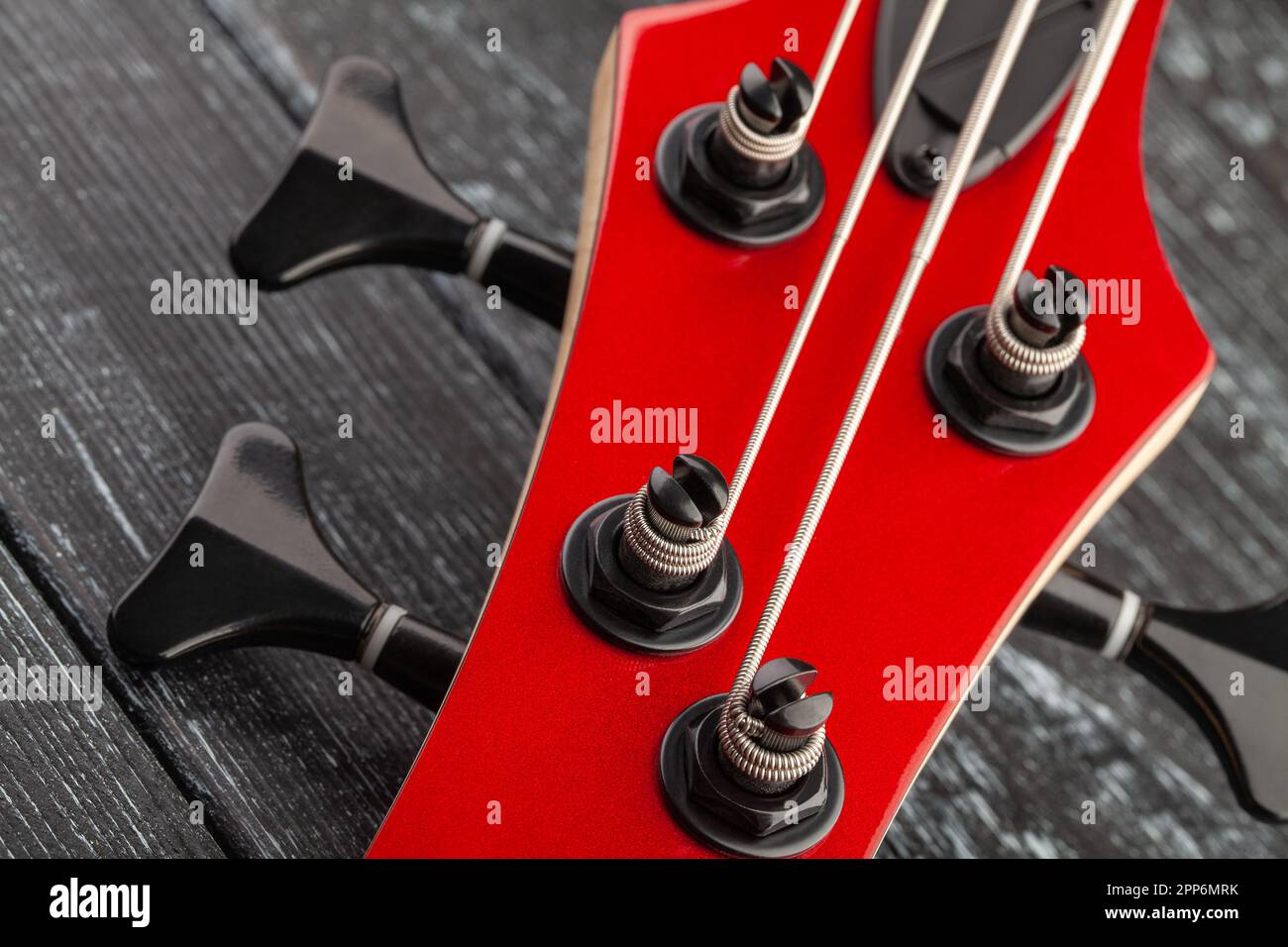 bass guitar tuning machines on wood background Stock Photo