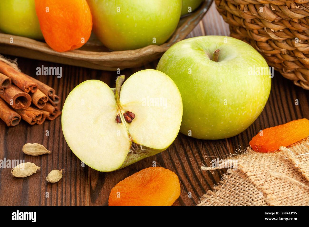 sliced granny smith apple on wood background Stock Photo