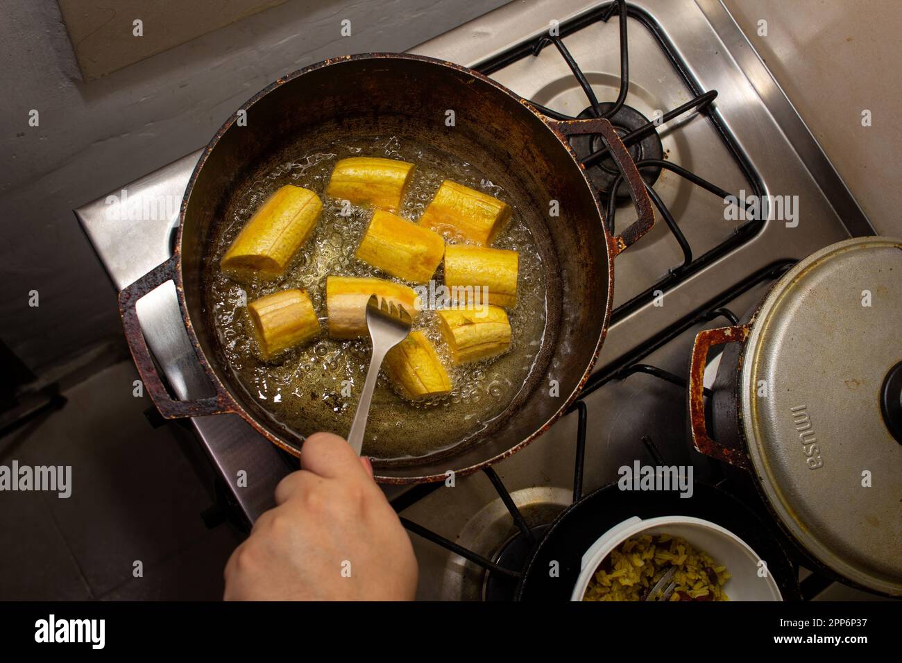 fry plantains with oil in a pan Stock Photo Alamy
