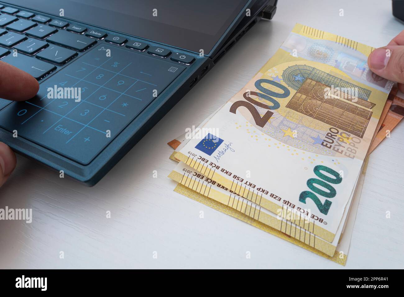 Man working on financial report at the office, closeup. calculation of and expenses on