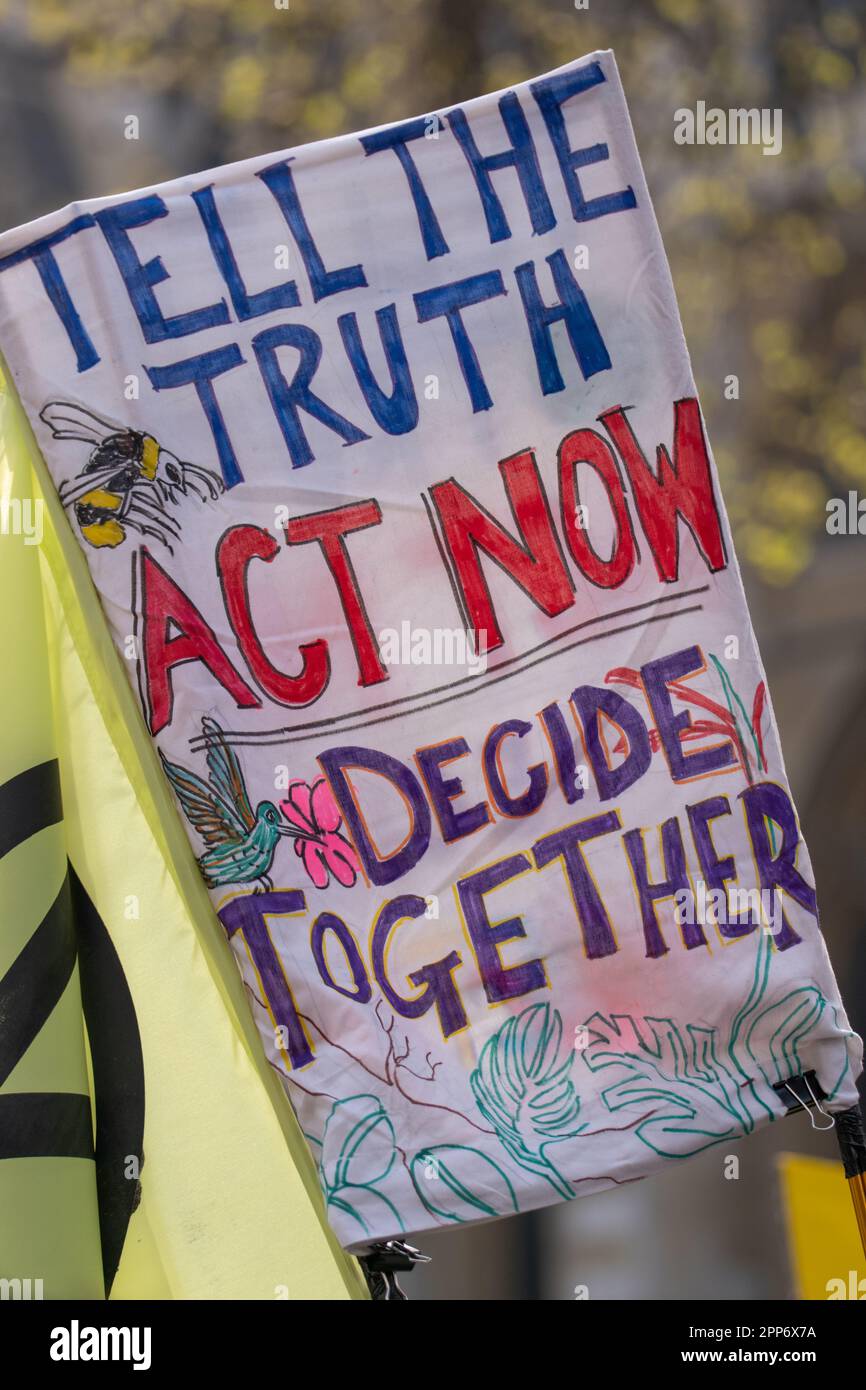 London, UK . 22nd Apr, 2023. 'Tell the Truth Act now banner' at Extinction Rebellion, The Big one, day 2 ,( saturday). Involved the 'Big One march for biodiversity'which ended with a 'die in'. Members of the 'Red Rebel Brigade 'and 'Green spirits' attended, 22 April 2023. London United KIngdom Picture garyroberts/worldwidefeatures.com Credit: GaryRobertsphotography/Alamy Live News Credit: GaryRobertsphotography/Alamy Live News Stock Photo