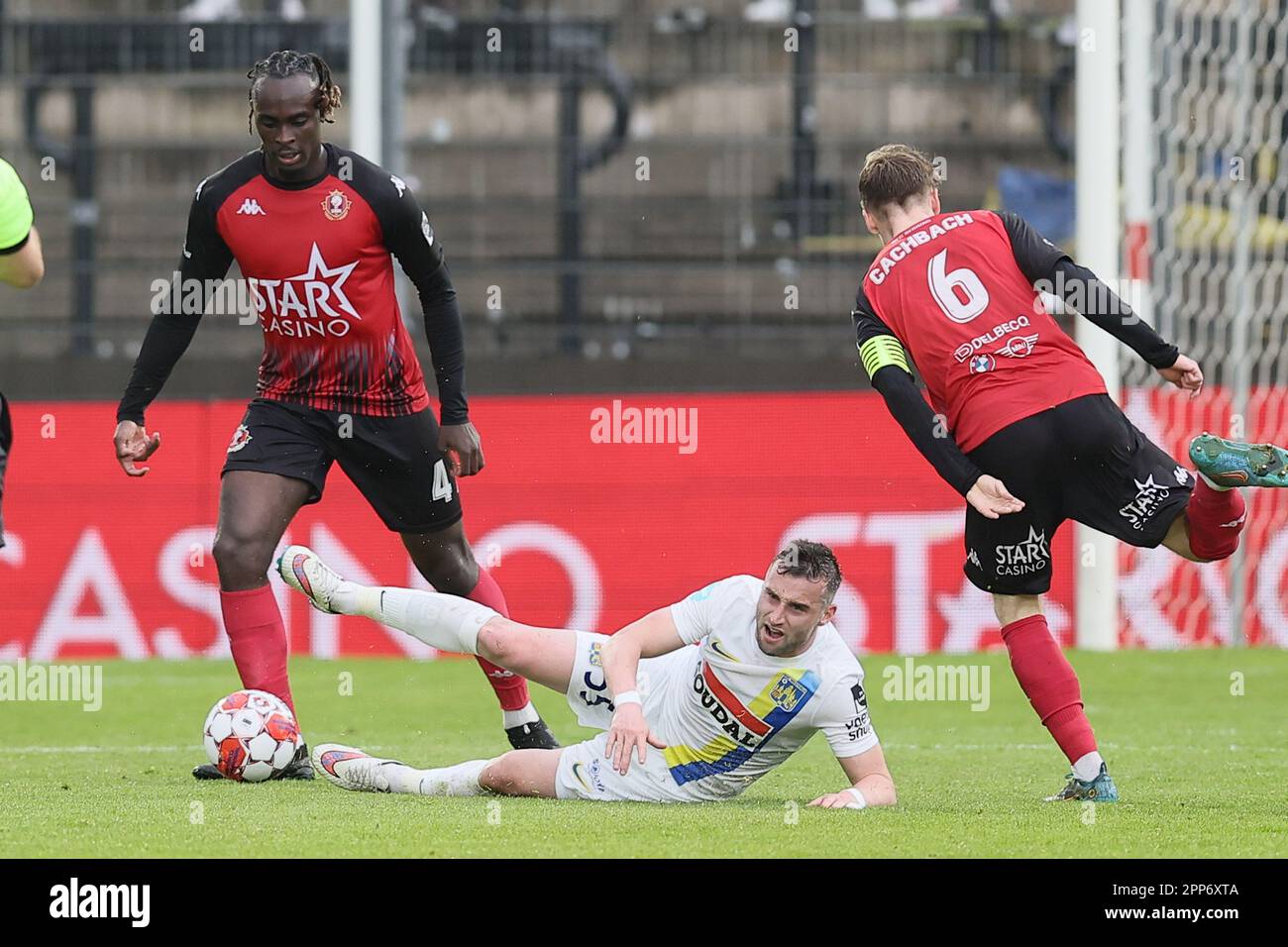 Seraing, Belgium. 22nd Apr, 2023. Seraing's Marvin Silver Tshibuabua, Westerlo's Tuur Dierckx and Seraing's Mathieu Cachbach fight for the ball during a soccer match between RFC Seraing and KVC Westerlo, Saturday 22 April 2023 in Seraing, on day 34 of the 2022-2023 'Jupiler Pro League' first division of the Belgian championship. BELGA PHOTO BRUNO FAHY Credit: Belga News Agency/Alamy Live News Stock Photo