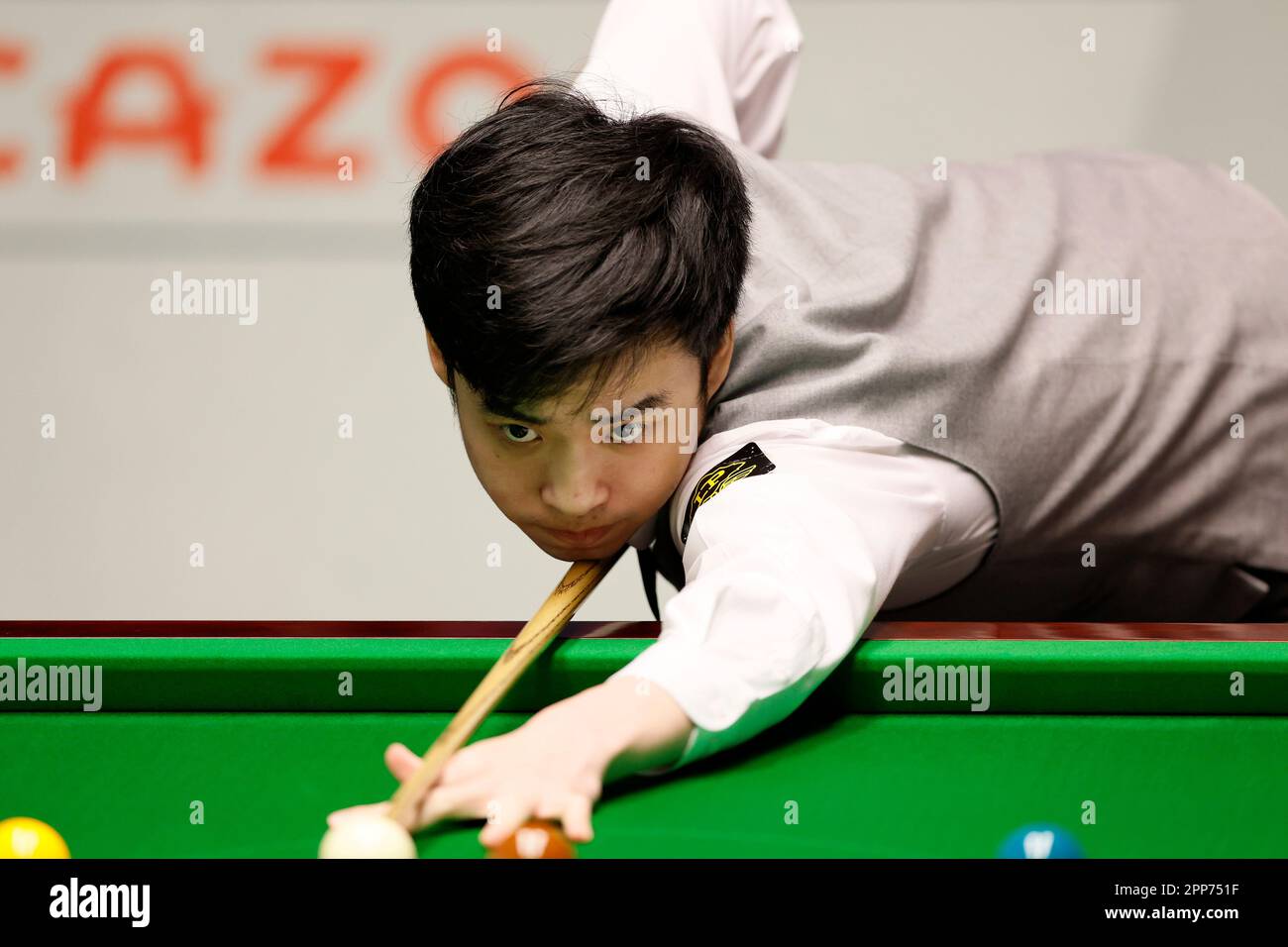 Si Jiahui at the table during day eight of the Cazoo World Snooker Championship at the Crucible Theatre, Sheffield