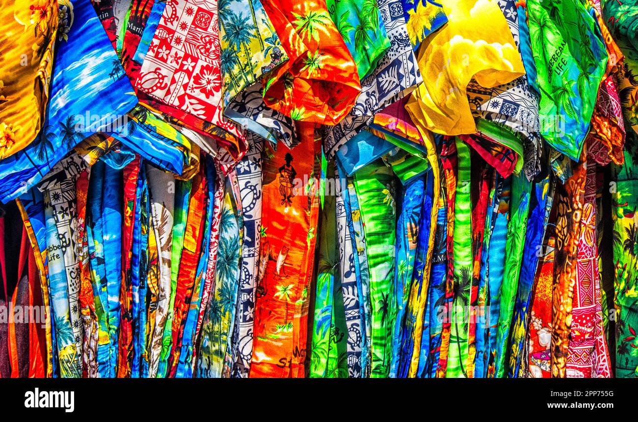 colourful shirts for sail on a market stall in the Caribbean. Stock Photo