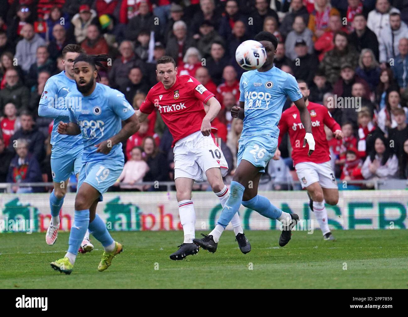 Wrexham's Paul Mullin (centre) scores their side's second goal of the