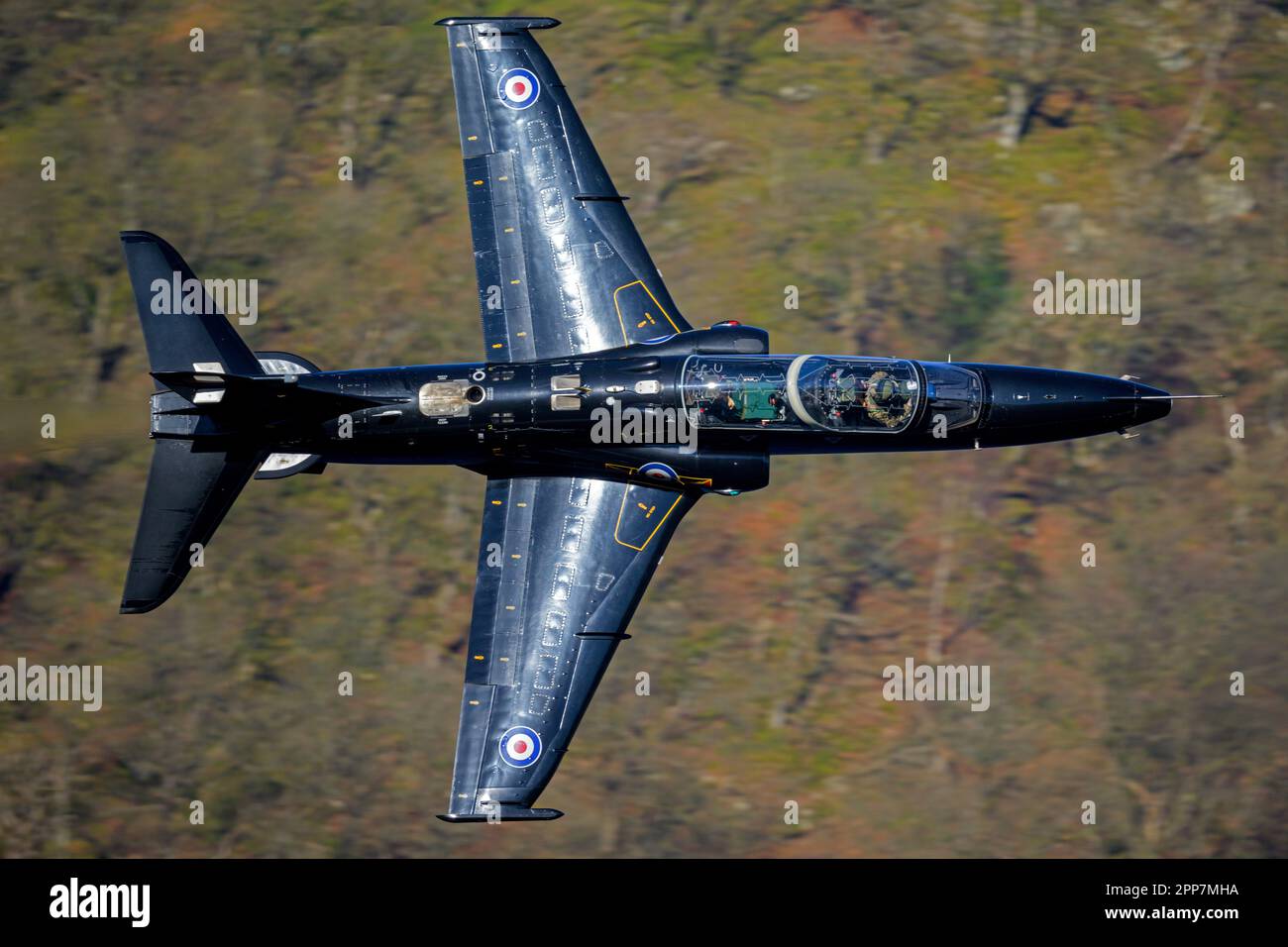 Royal Air Force Hawk T2 jet trainer navigating through low flying area 17, (The Lake District) Stock Photo
