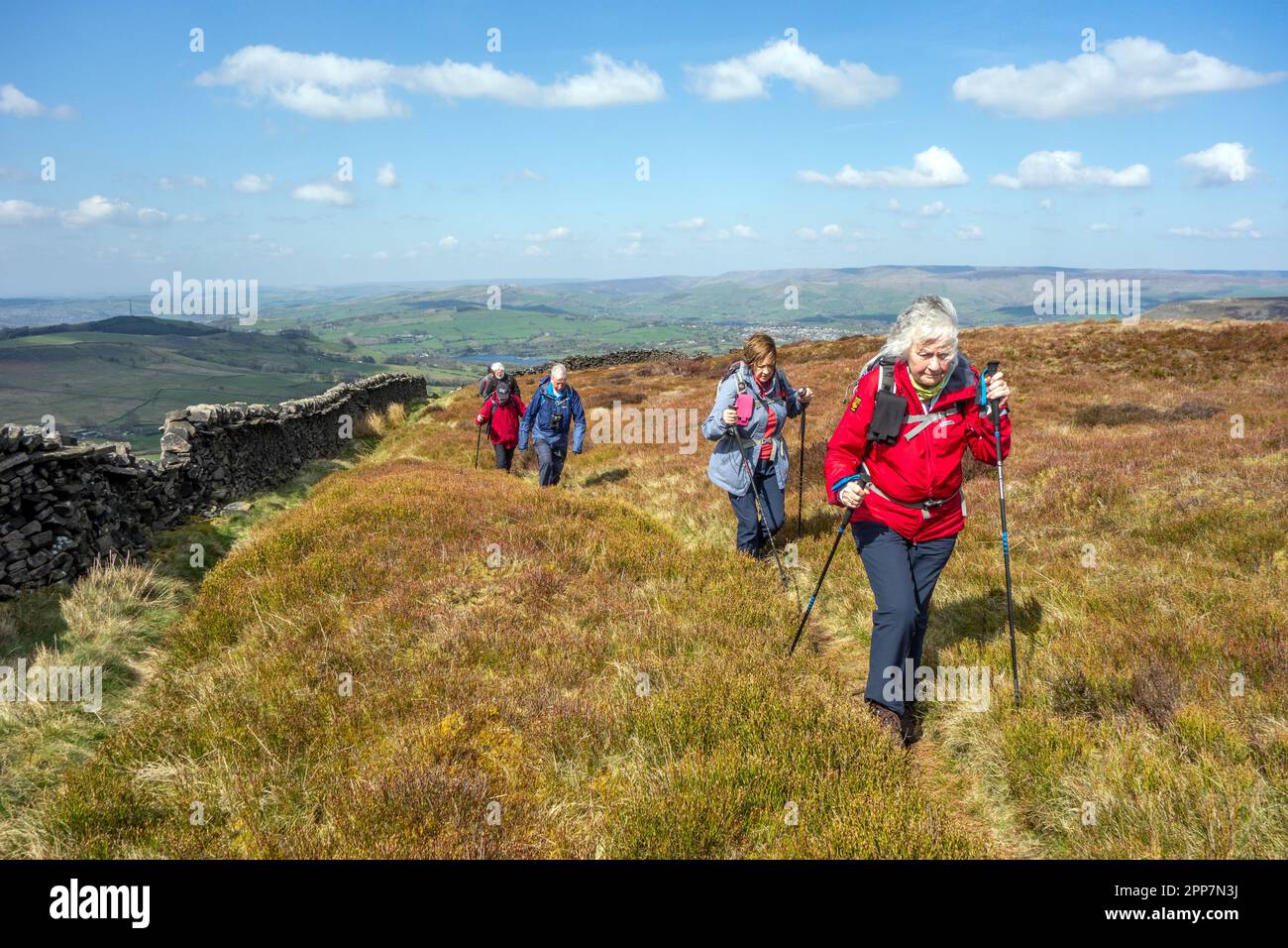 Members of the Sandbach U3A long walking group enjoying rambling in the Peak District hills above the Derbyshire town of Buxton England Stock Photo