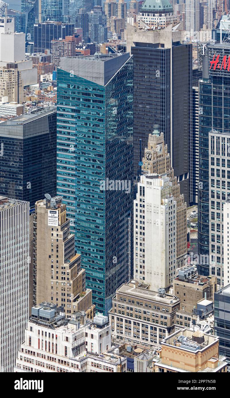 Turquoise Times Square Tower, black One Astor Plaza and One Five One, white Continental Building, and tan Paramount Building hide Times Square itself. Stock Photo