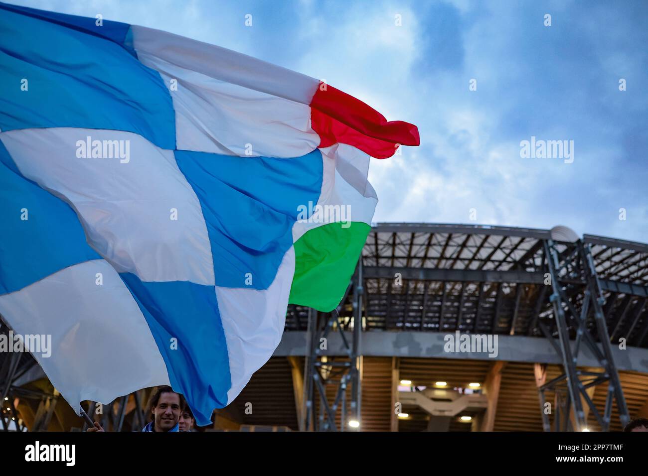 Naples, Italy, 18th April 2023. A fan waves a giant flag in a general view of the stadium prior to the UEFA Champions League match at Stadio Diego Armando Maradona, Naples. Picture credit should read: Jonathan Moscrop / Sportimage Stock Photo