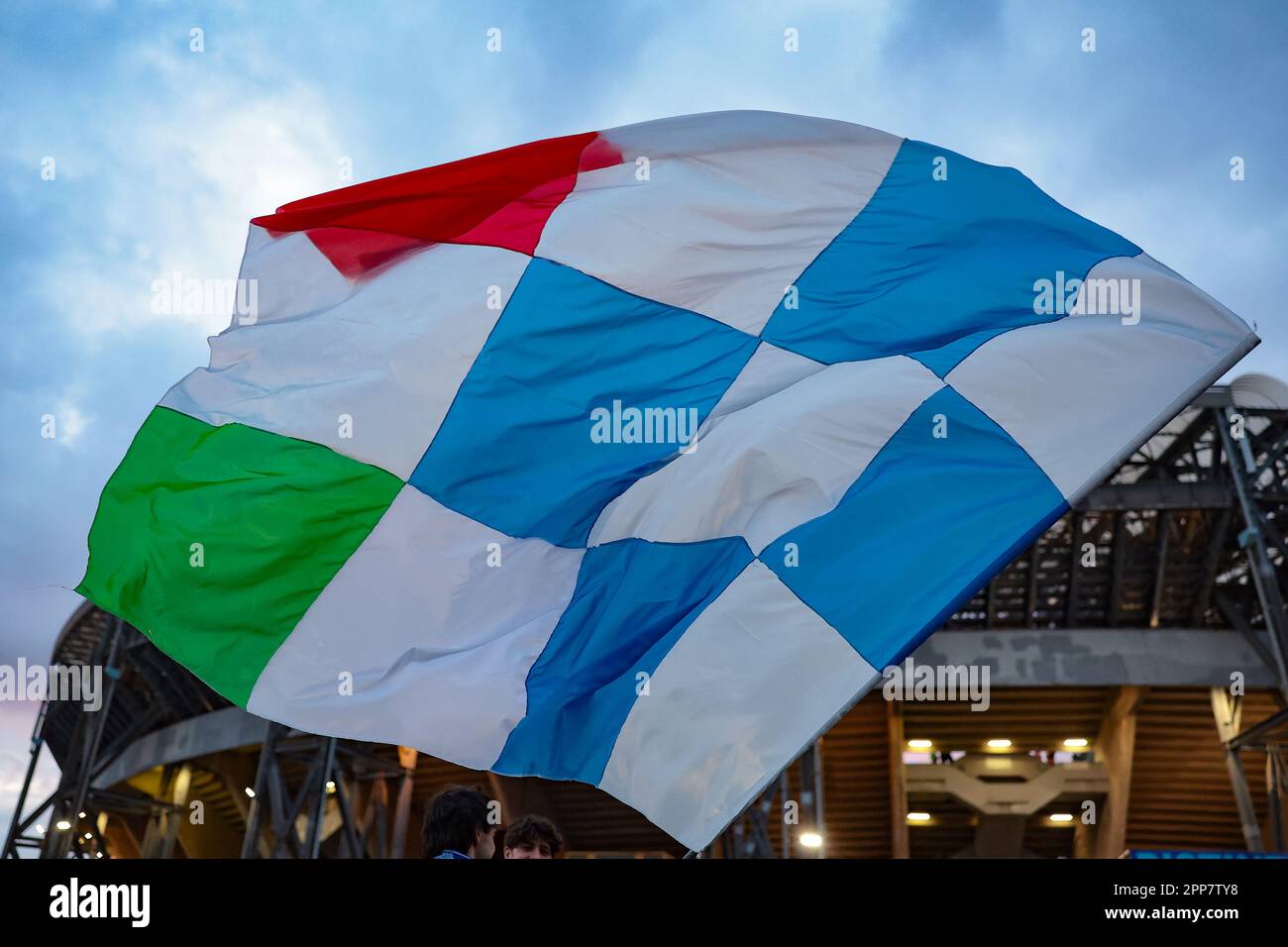 Naples, Italy, 18th April 2023. A fan waves a giant flag in a general view of the stadium prior to the UEFA Champions League match at Stadio Diego Armando Maradona, Naples. Picture credit should read: Jonathan Moscrop / Sportimage Stock Photo