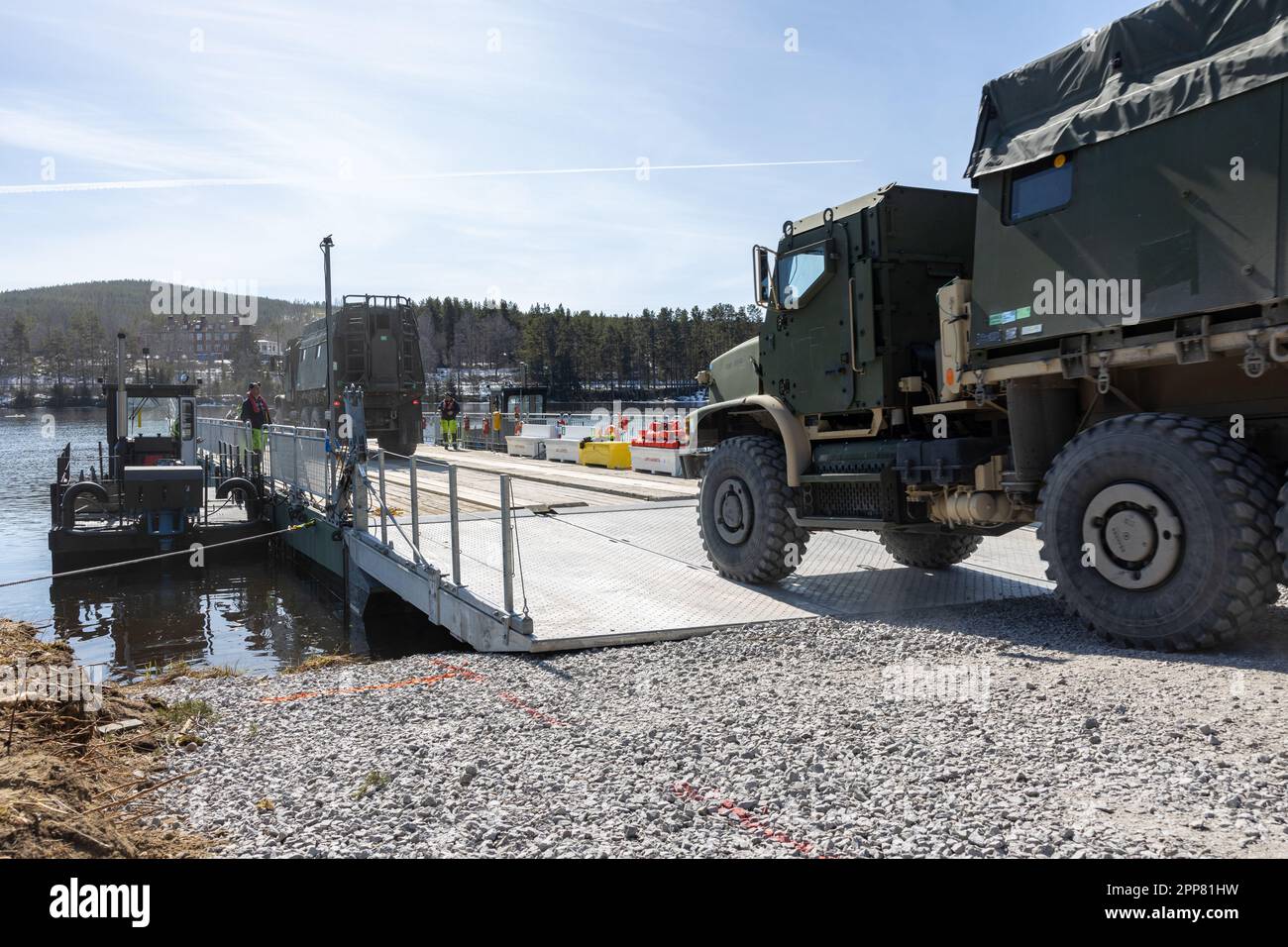 U.S. Marines with 2d Combat Engineer Battalion, 2d Marine Division, board a ferry during ferry crossing operations near Sveg, Sweden, April 18, 2023. Marines are deployed to Norway as part of Marine Rotational Forces Europe 23.1 which focuses on regional engagements throughout Europe by conducting various exercises, arctic cold-weather and mountain warfare training, and military-to-military engagements, which enhance overall interoperability of the U.S. Marine Corps with allies and partners. (U.S. Marine Corps photo by Sgt. Christian M. Garcia) Stock Photo