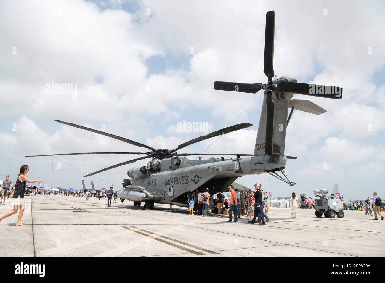 Festival attendees look at a U.S. Marine Corps CH-53E Super Stallion ...