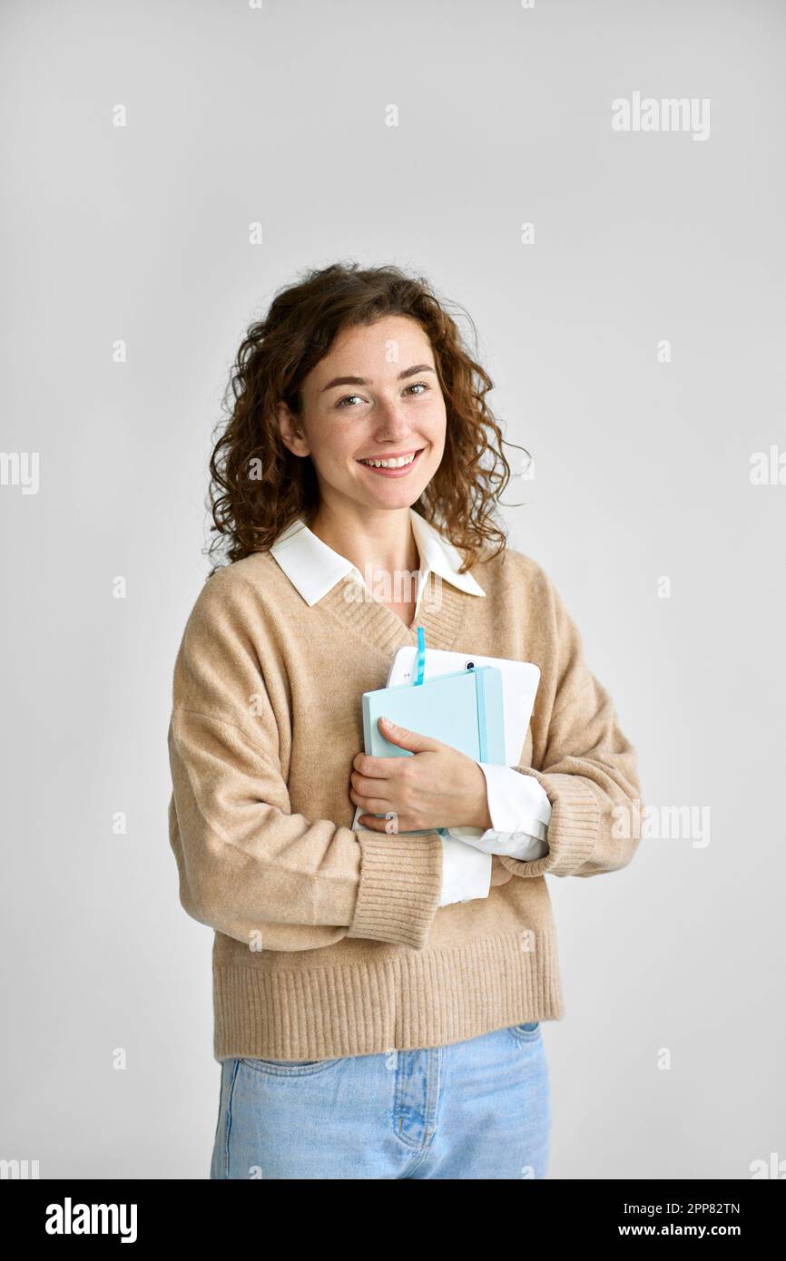 Young happy pretty cute girl student holding digital tablet. Stock Photo