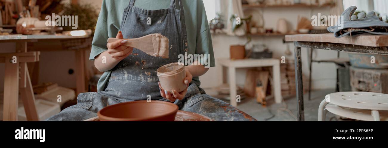 Female potter making earthenware in pottery workshop Stock Photo - Alamy