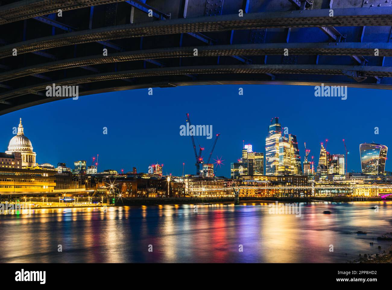 View of St. Pauls Cathedral and Skyscrapers from under Blackfriars Bridge, River Thames, London, England Stock Photo