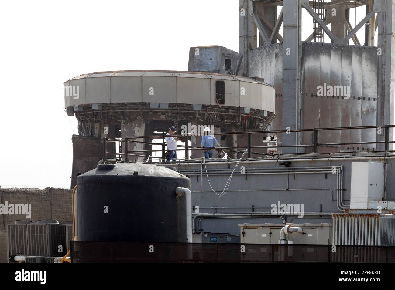 Boca Chica, United States. 22nd Apr, 2023. Workers check out 