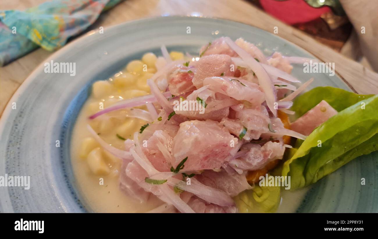 Ceviche is a popular Latin American dish made with raw seafood that is marinated in citrus