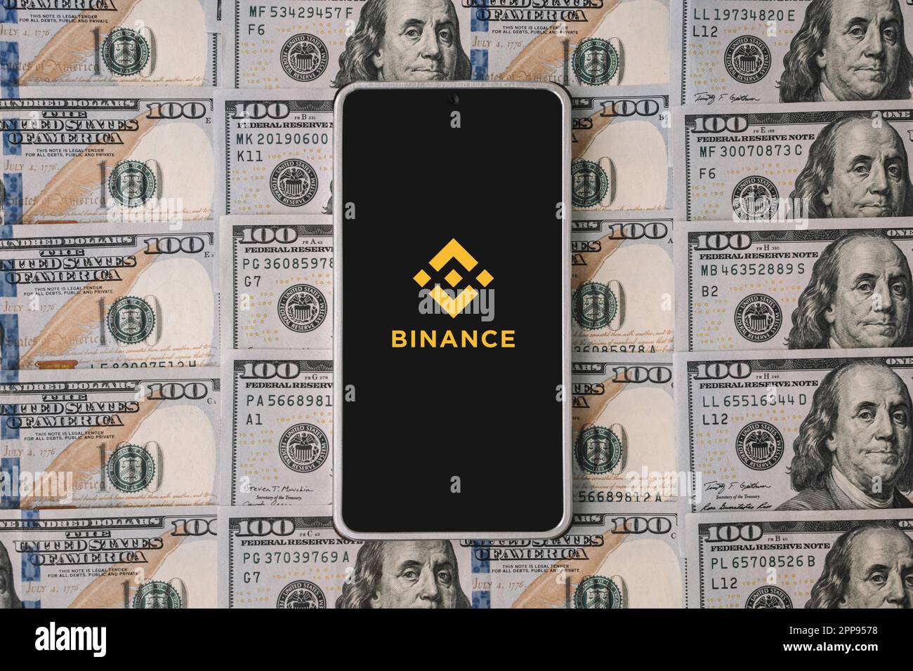 Phone and Binance logo and dollars. Binance is a cryptocurrency exchange.  March 30, 2023. Barnaul. Russia Stock Photo - Alamy