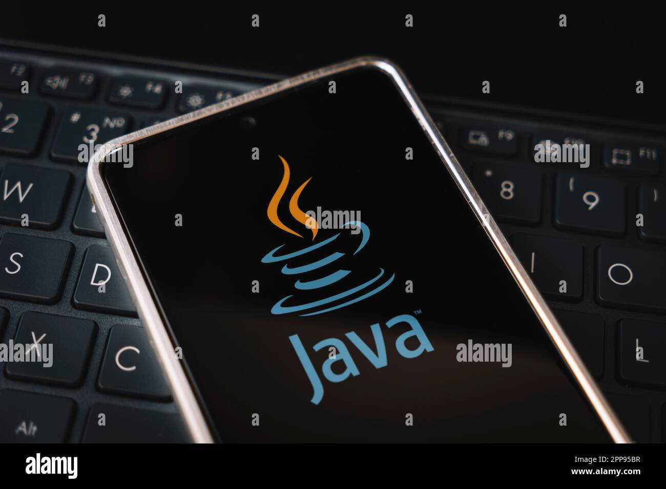 Java Programming language for mobile development, concept. Smartphone on the laptop keyboard. logo java on the mobile phone screen. Barnaul. Russia Ma Stock Photo