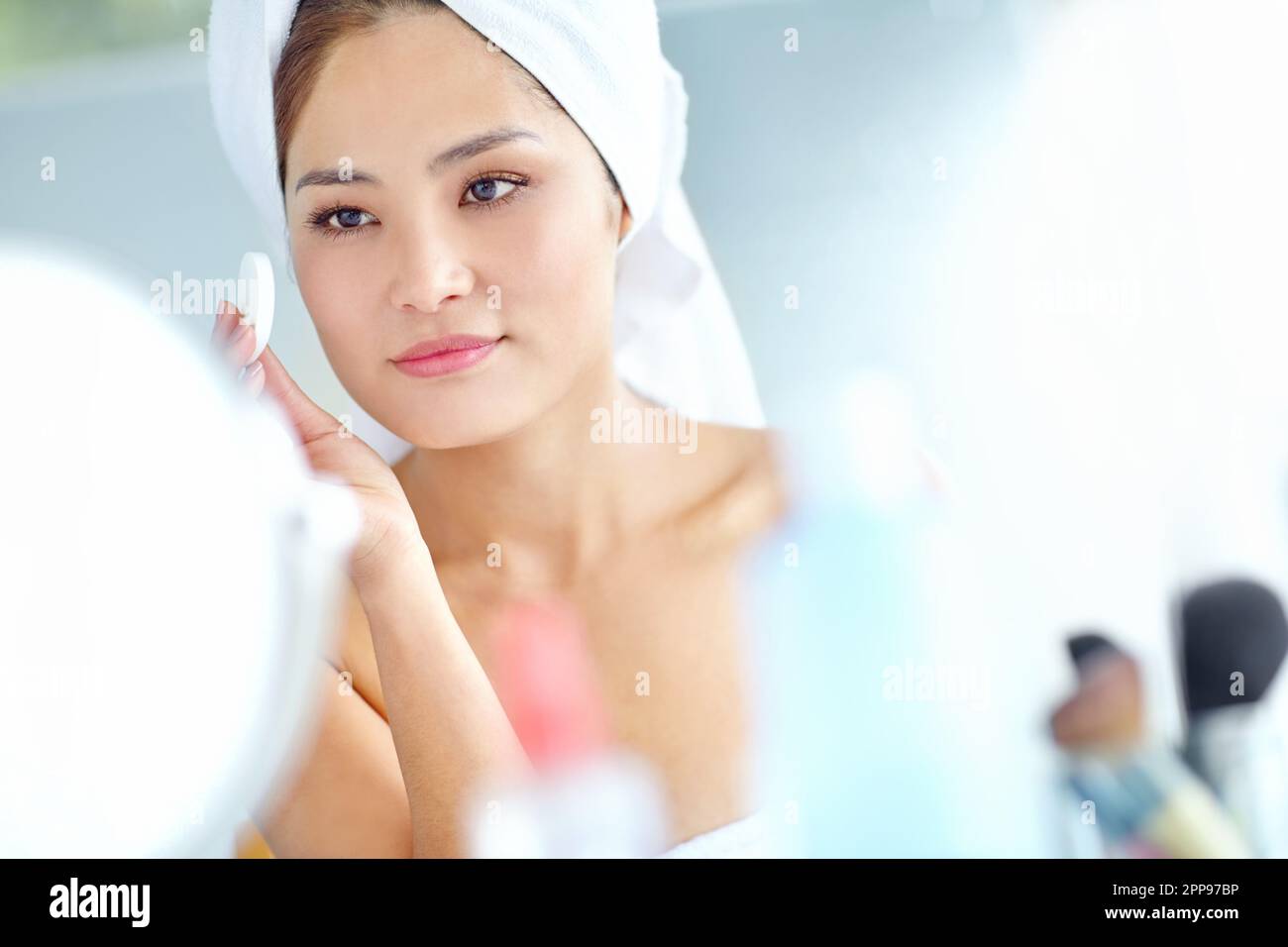 Maintaining her flawless beauty. An attactive young Asian woman 
