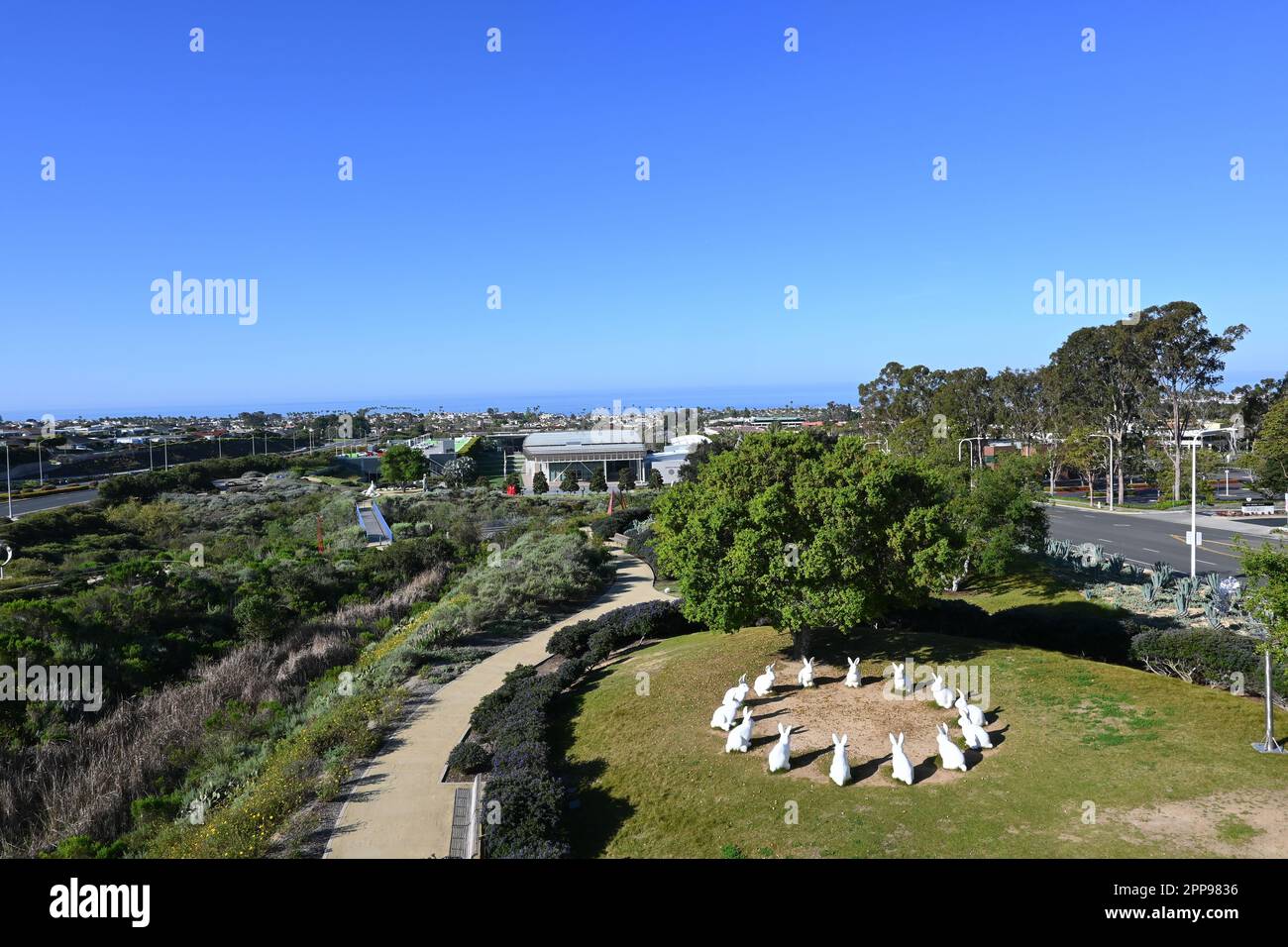 NEWPORT BEACH, CALIFORNIA - 22 APR 2023: Bunnyhenge in Civic Center Park, a public art display of 14 large white bunnies, arranged in a circle. Stock Photo