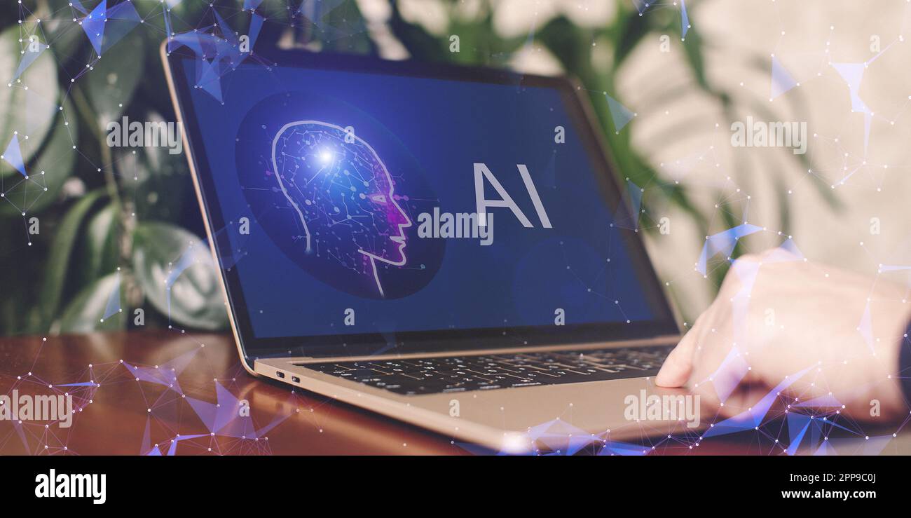 Man using Laptop or Smartphone With AI, Artificial Stock Photo