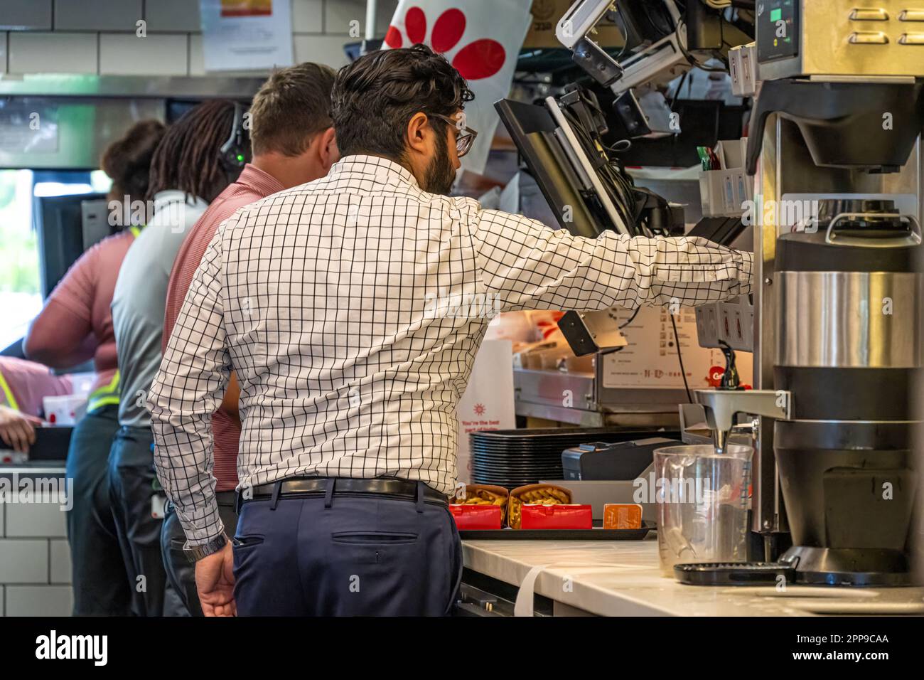 Chick-fil-A team members fulfilling food orders in Ormand Beach, Florida. (USA) Stock Photo