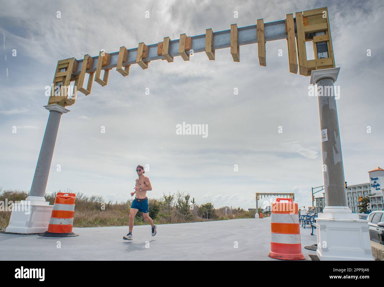 Cape May, United States. 22nd Apr, 2023. A runner passes through the