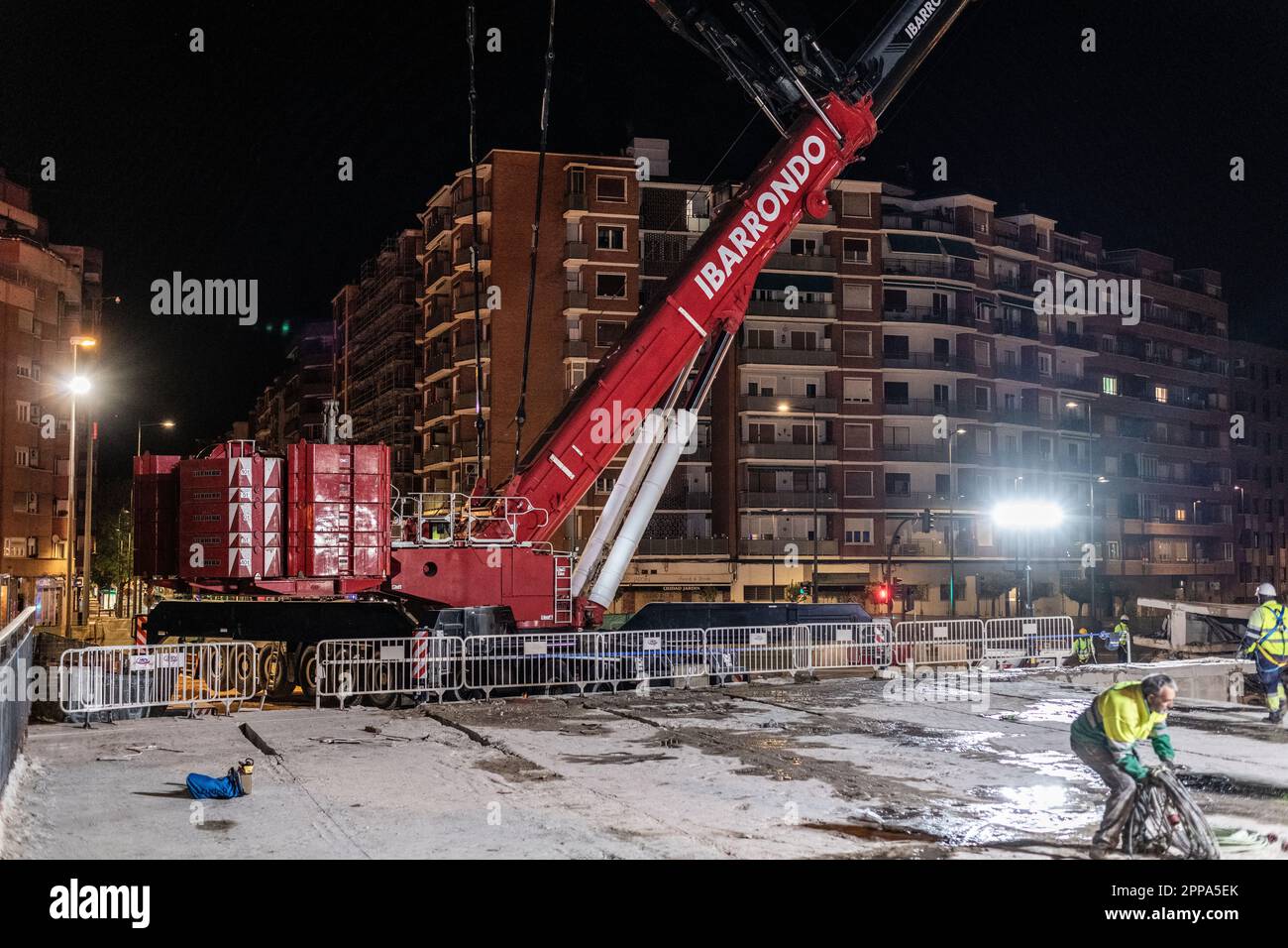 Logroño, Spain; 23rd April 2023: Construction workers working at night on the dismantling of the bridge over the railway track on Vara de Rey street, Stock Photo