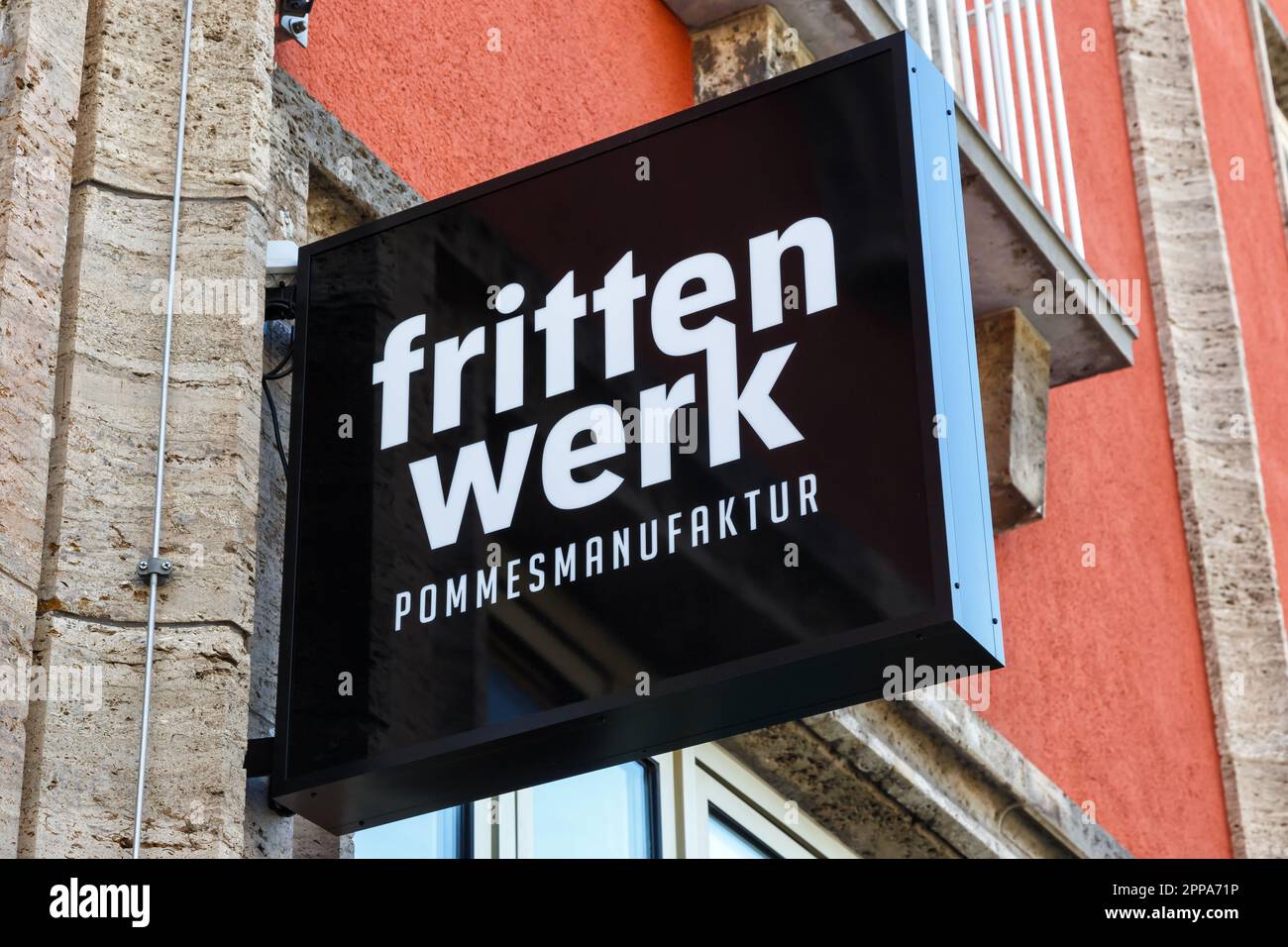 Stuttgart, Germany - April 10, 2023: Frittenwerk fast food French fries restaurant brand with logo in Stuttgart, Germany. Stock Photo