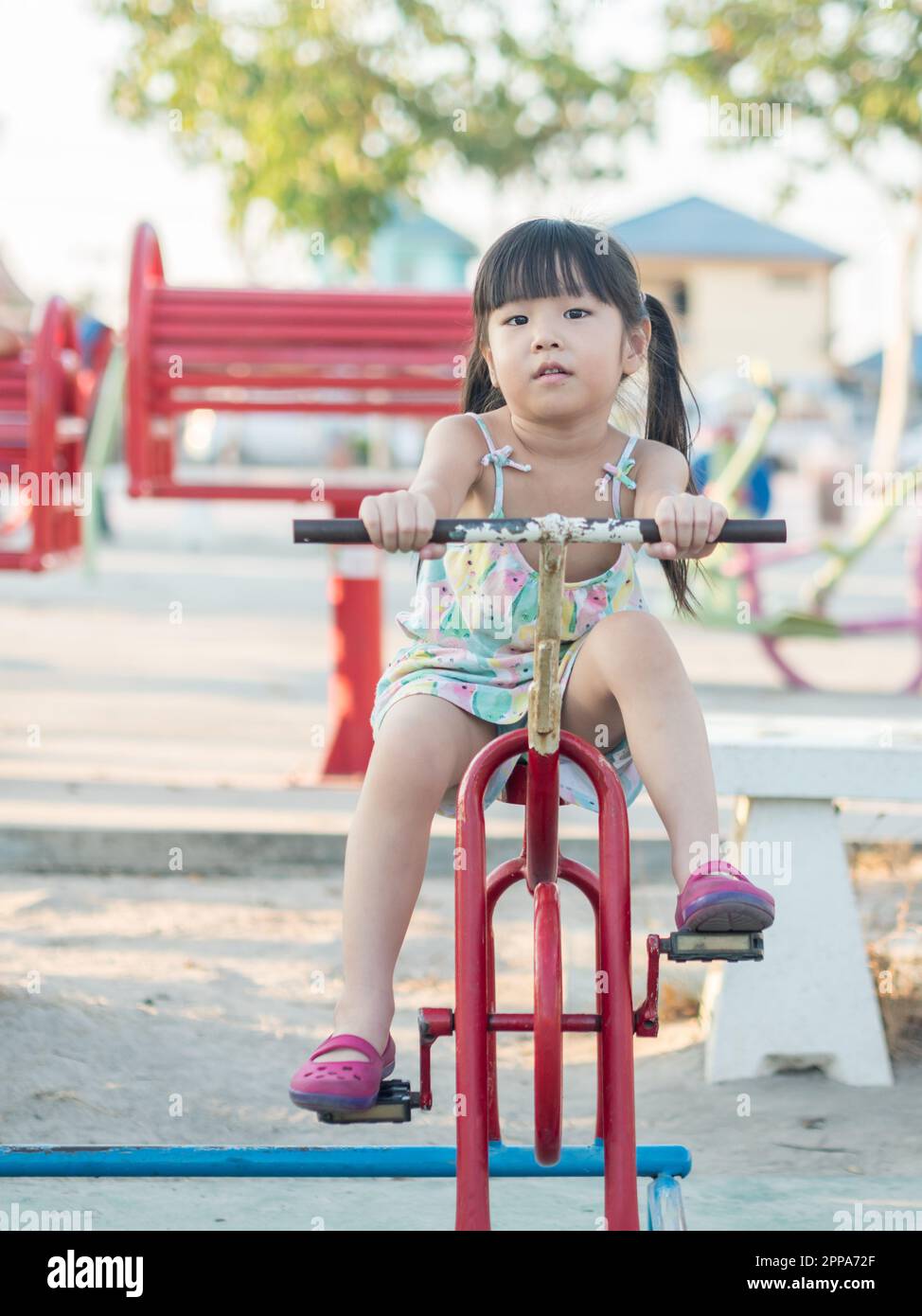 Two happy little asian kids playing outdoor in the sunny park Stock Photo -  Alamy