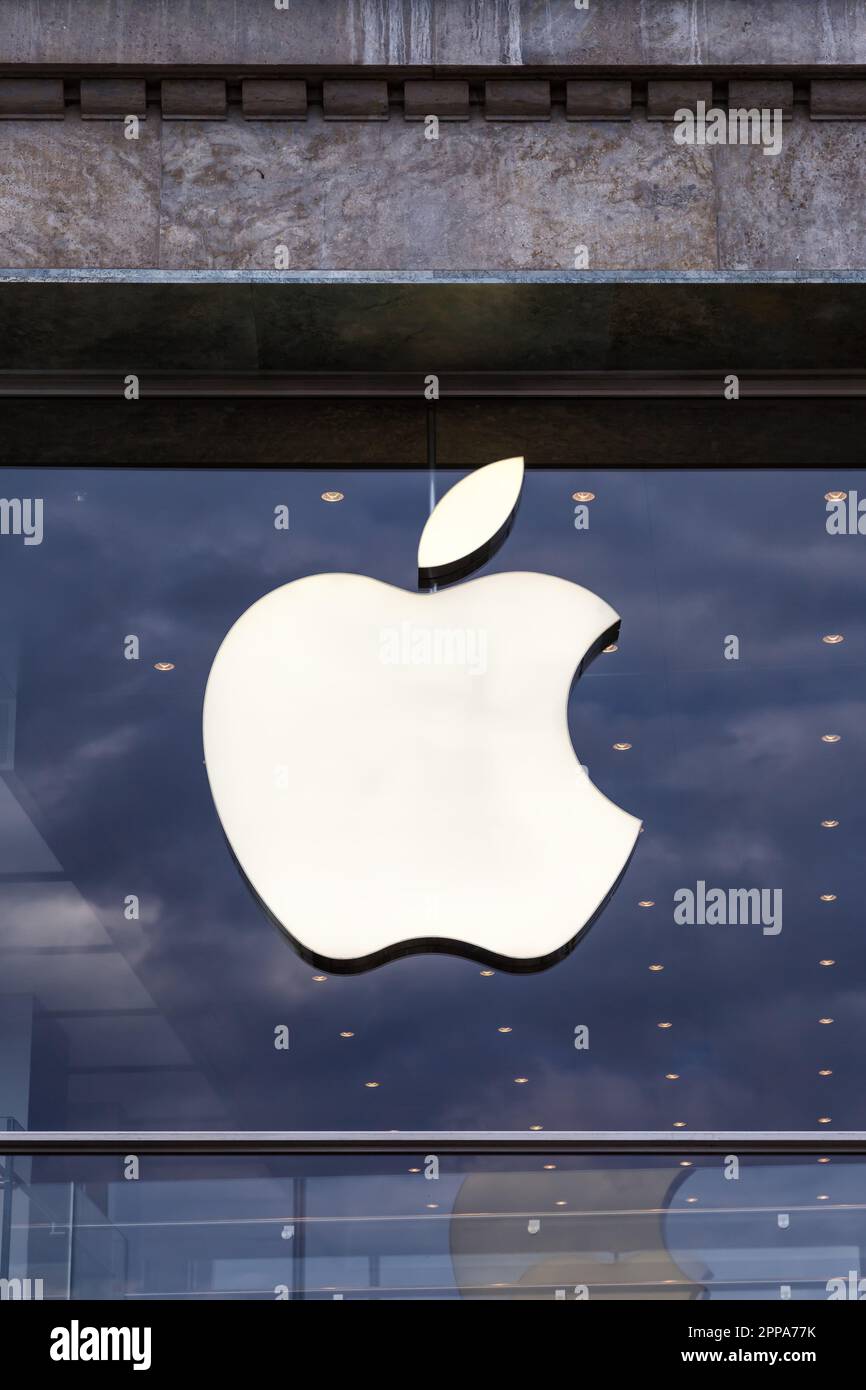 Hamburg, Germany - August 13, 2022: Apple logo brand on a store portrait format in Hamburg, Germany. Stock Photo