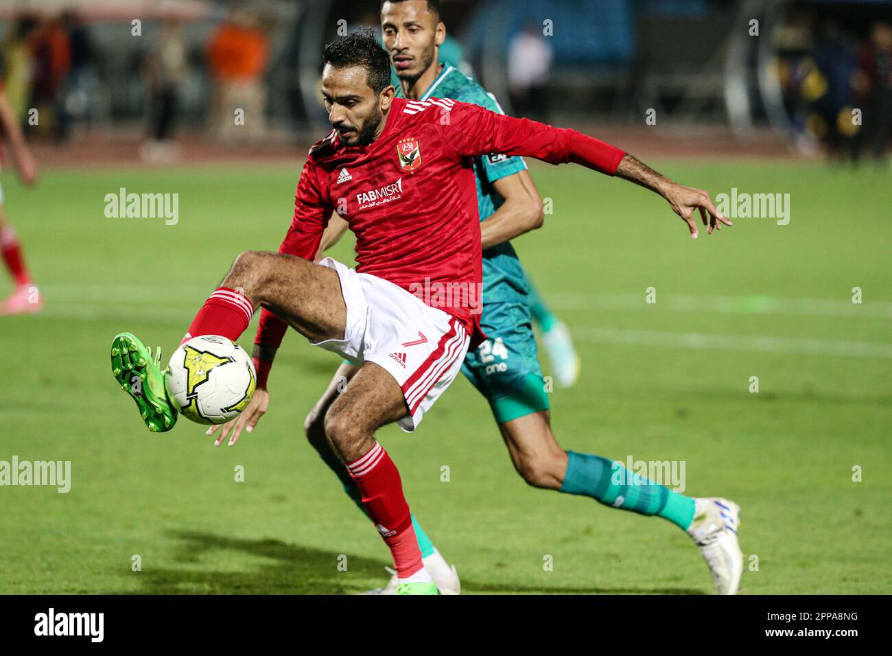 Cairo. 22nd Apr, 2023. Kahraba (front) of Al Ahly competes during a Confederation of African Football (CAF) Champions League quarterfinal match between Al Ahly and Raja Casablanca in Cairo, Egypt on April 22, 2023. Credit: Ahmed Gomaa/Xinhua/Alamy Live News Stock Photo