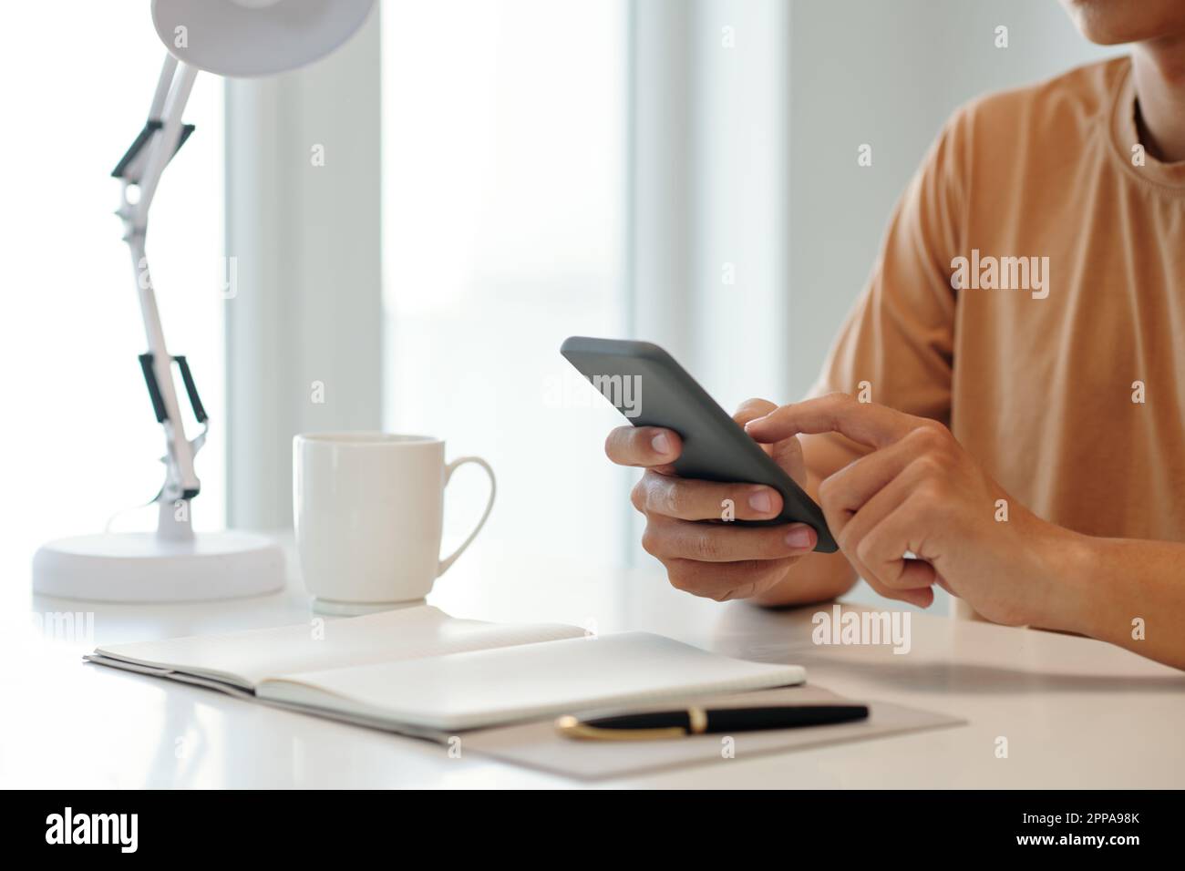 Businessman using application on smartphone when planning day Stock Photo
