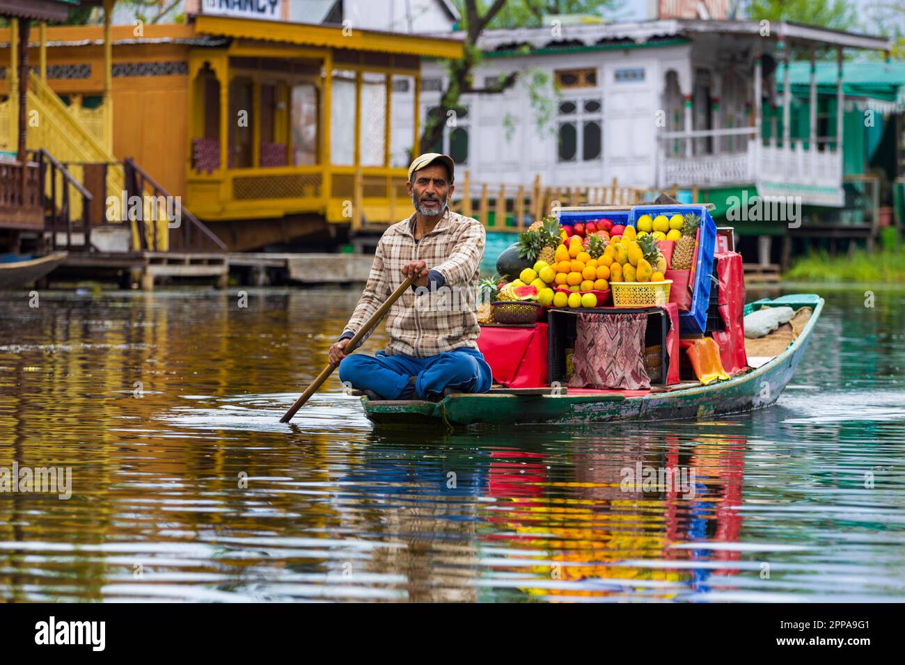A fruit seller on a shikara at the Dal Lake in Srinagar, Kashmir, India