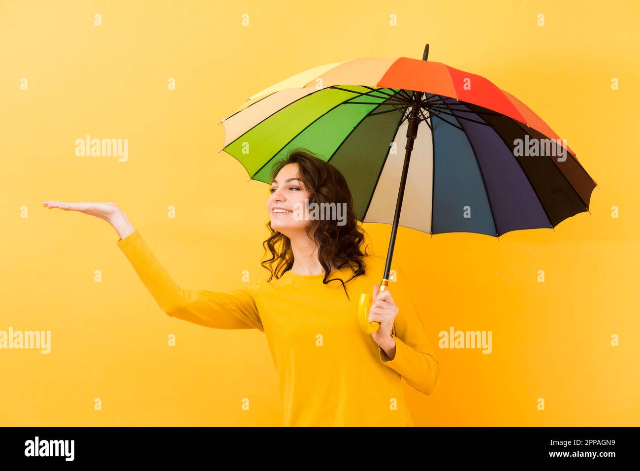 Front view woman with rainbow umbrella Stock Photo