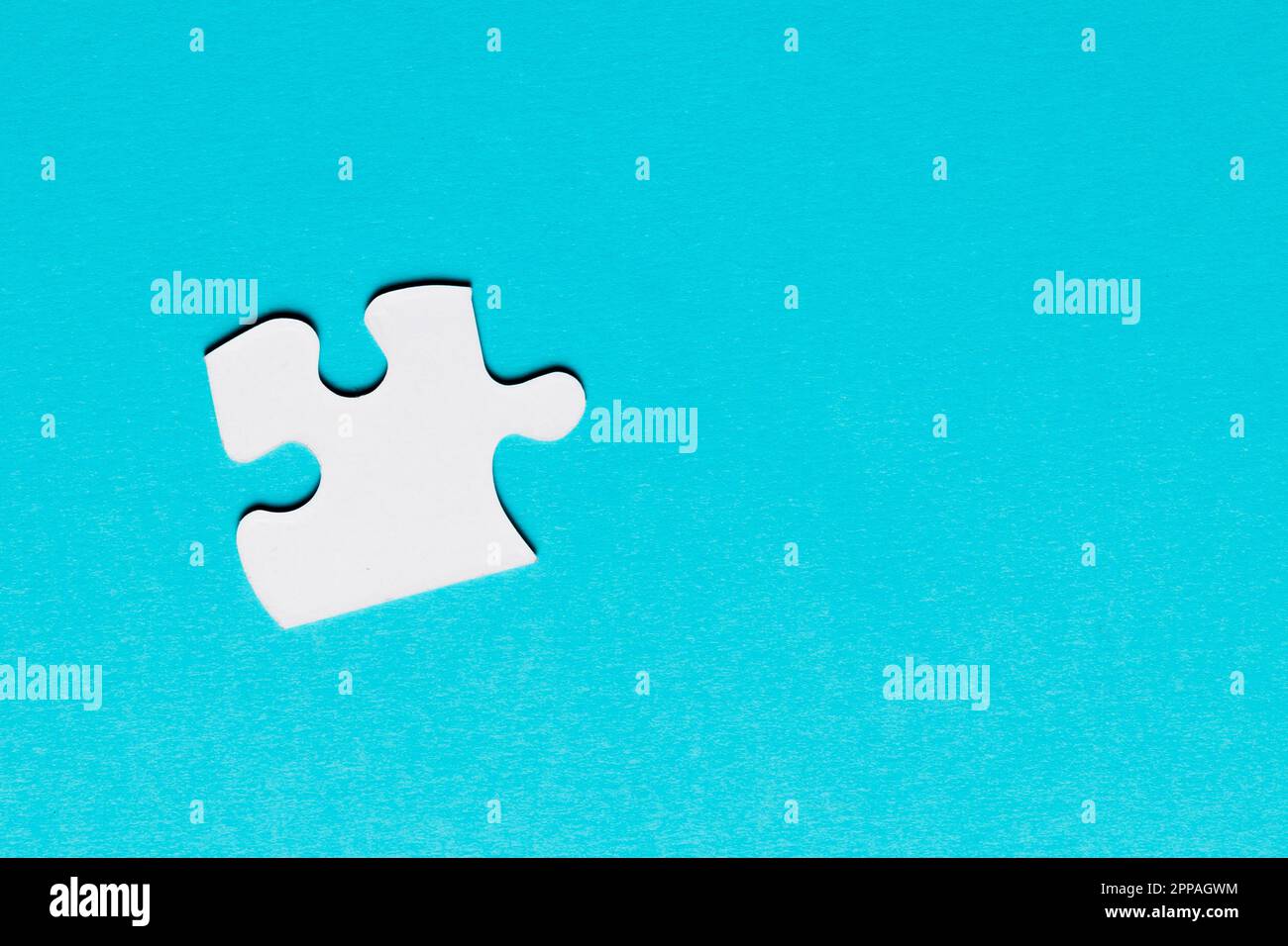 White single puzzle piece blue background Stock Photo