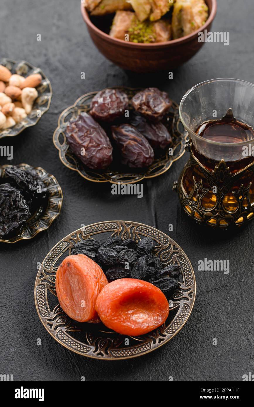 Turkish tea with dates dried apricot raisin arabian iron plate ramadan