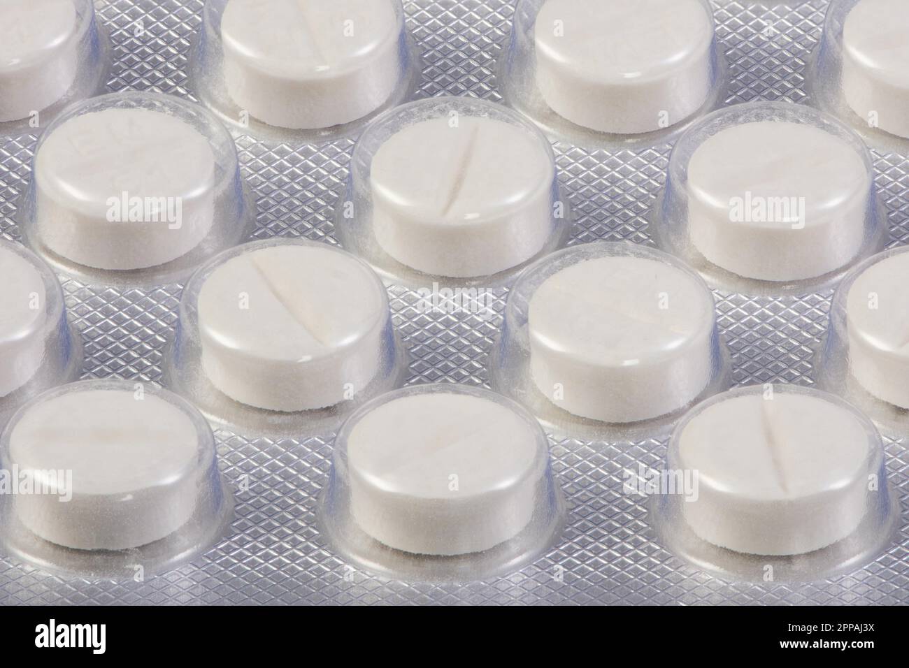Blister pack with white painkiller tablets Stock Photo