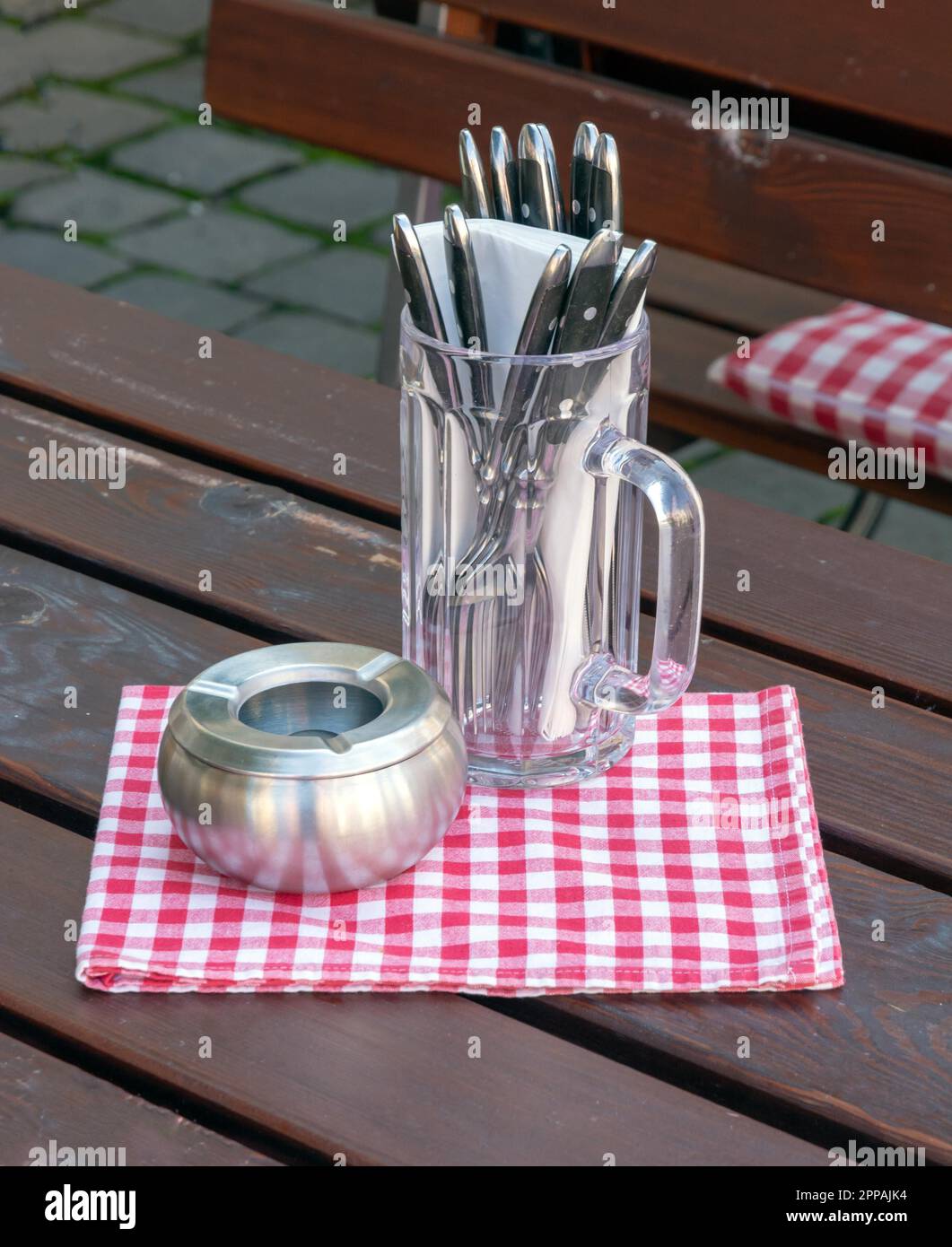 Cutlery and ashtray on the table of a traditional bavarian restaurant Stock Photo