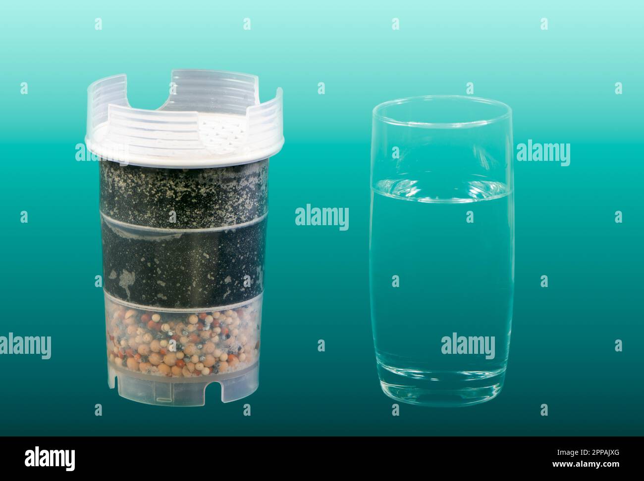 Water purification filter with active carbon and a glass of fresh and