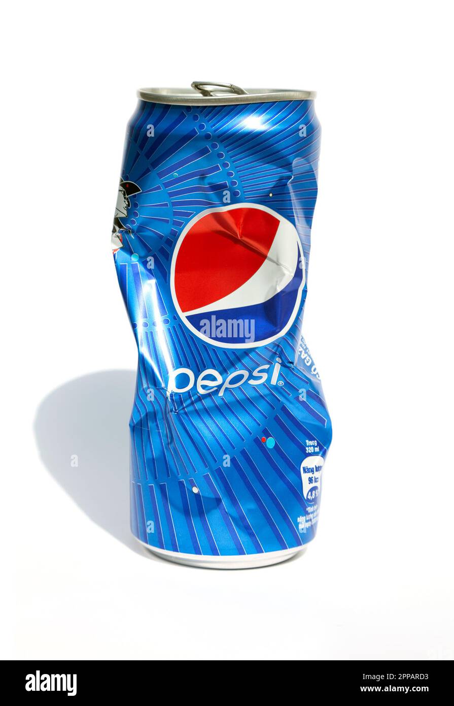Ho Chi Minh City, Vietnam - April 23, 2023: Crushed aluminum soda can with Pepsi logo isolated on white. Opened empty crumpled can of famous soft drin Stock Photo