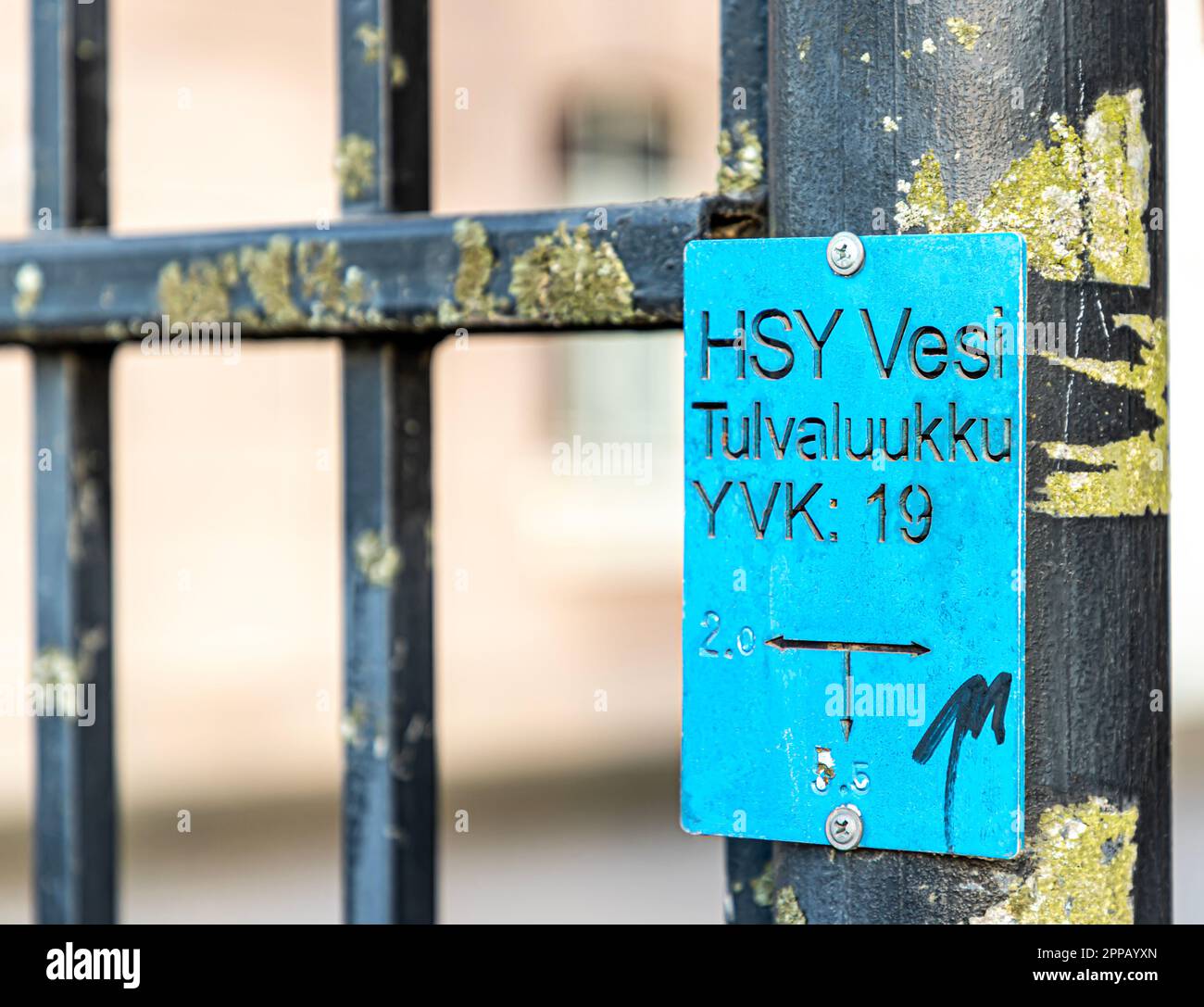 A Helsinki Region Environmental Services (HSY) sewer backwater valve sign on a gate near the coastline in Siltavuorenranta, Helsinki, Finland. Stock Photo