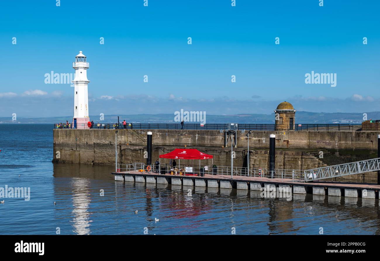 Newhaven Harbour lighthouse and Viking cruise ship jetty with clear blue sky, Edinburgh, Scotland, UK Stock Photo