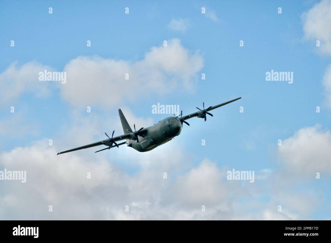 The picture is of a C-130 Hercules at the Mach Loop in north Wales where the aircraft fly in the valleys, thus enabling to get good photos. Stock Photo