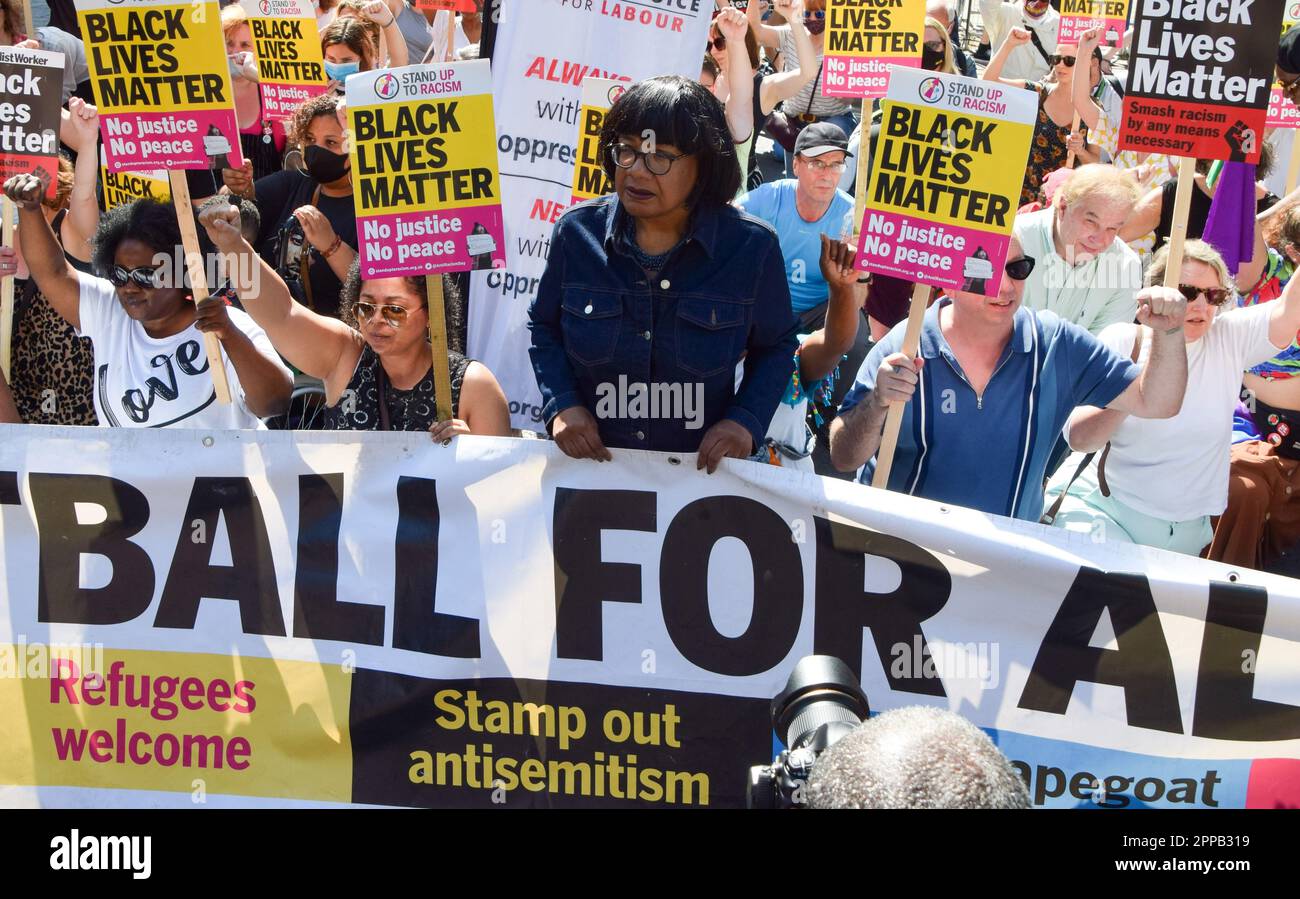 London, United Kingdom. 17th July 2021. Labour MP Diane Abbott stands behind a banner which reads 'Stamp out antisemitism'. Protesters held speeches and took the knee outside Downing Street in solidarity with England football players Marcus Rashford, Bukayo Saka and Jadon Sancho following the online racist abuse the trio received after the Euro 2020 final between England and Italy. Stock Photo