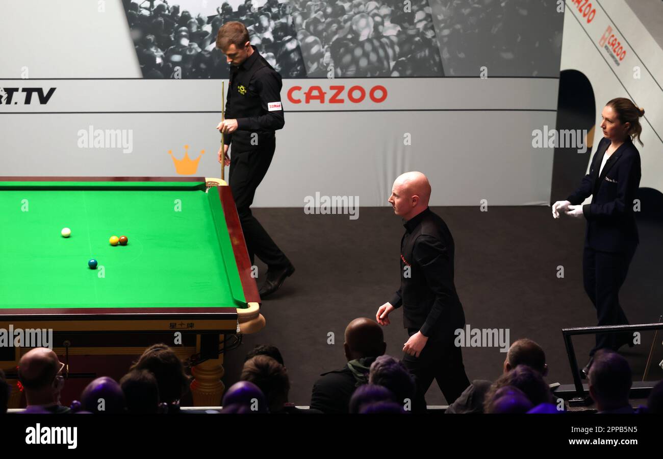 Referee Tatiana Woollaston suspends play in the match between Jack Lisowski (left) and Anthony McGill before the 3pm National Alert Test during during day nine of the Cazoo World Snooker Championship at