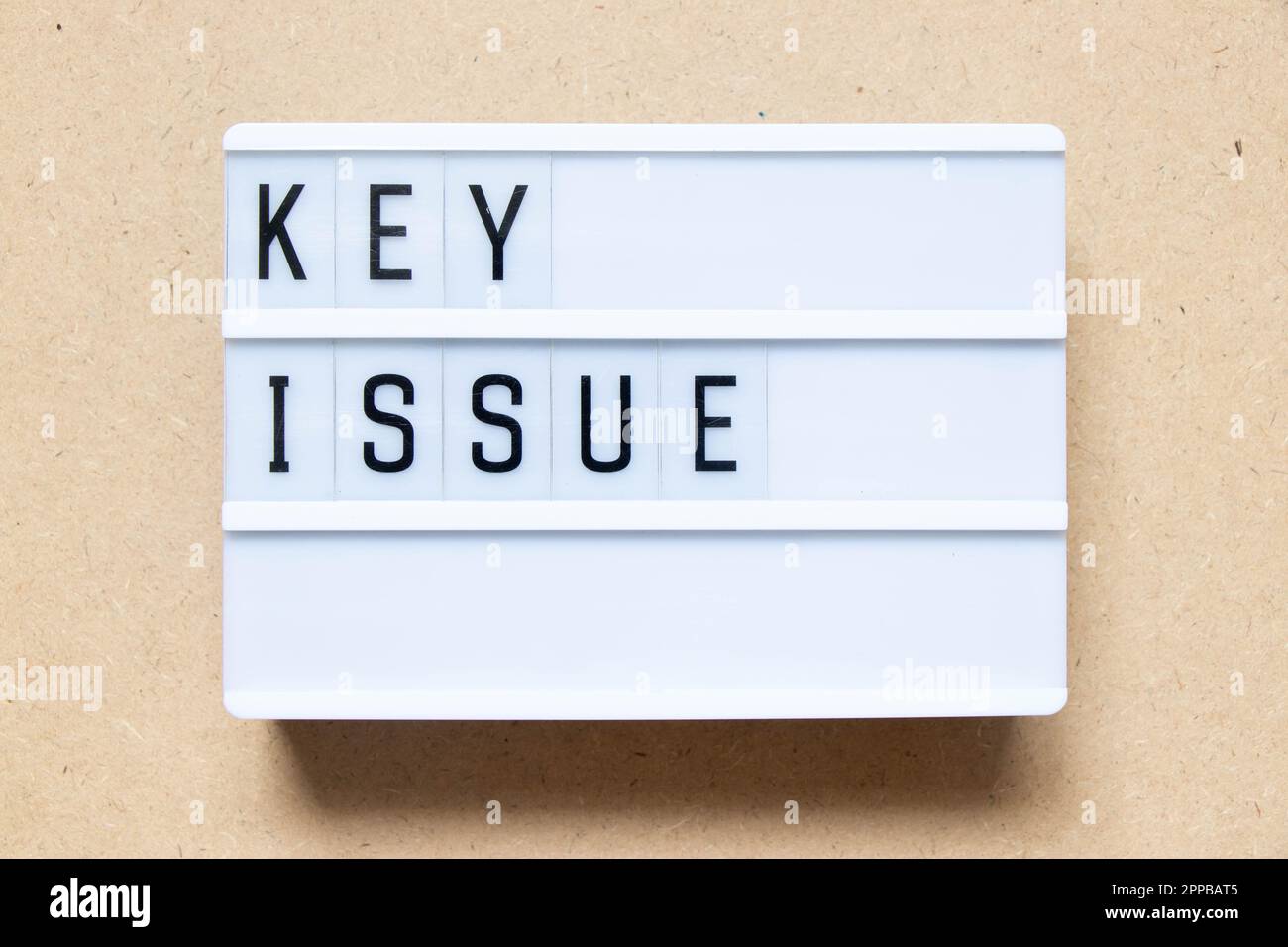 Lightbox with word key issue on wood background Stock Photo