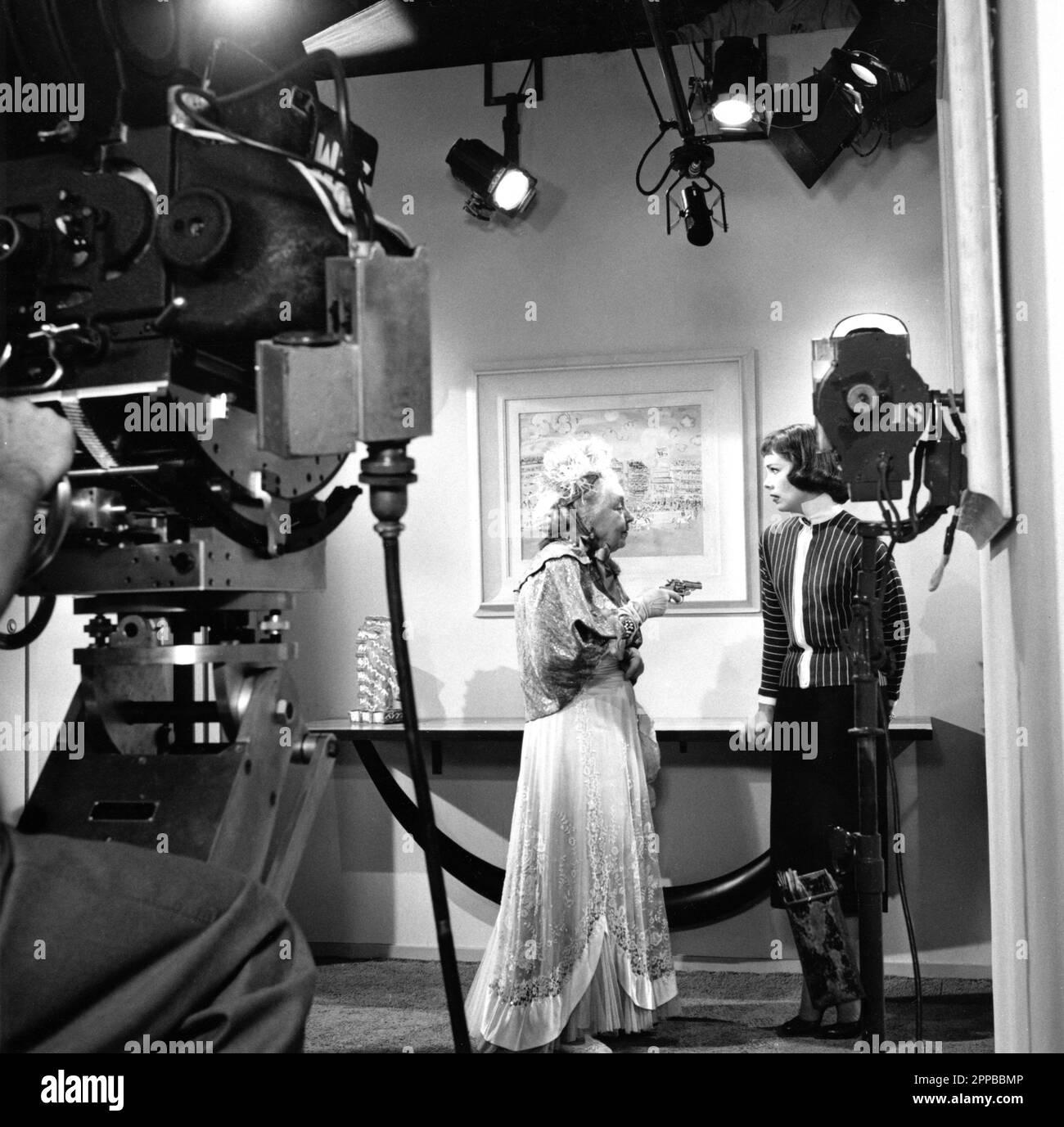 MARY YOUNG and PHYLLIS KIRK as Nora Charles on set candid during filming of Season 1 Episode 7 ACROSTIC MURDERS director OSCAR RUDOLPH characters created by Dashiell Hammett story and teleplay Phil Davis and Charles Hoffman aired on November 1st 1957 from THE THIN MAN TV Series 1957 - 1959 Clarington Productions / MGM Television / National Broadcasting Company (NBC) Stock Photo